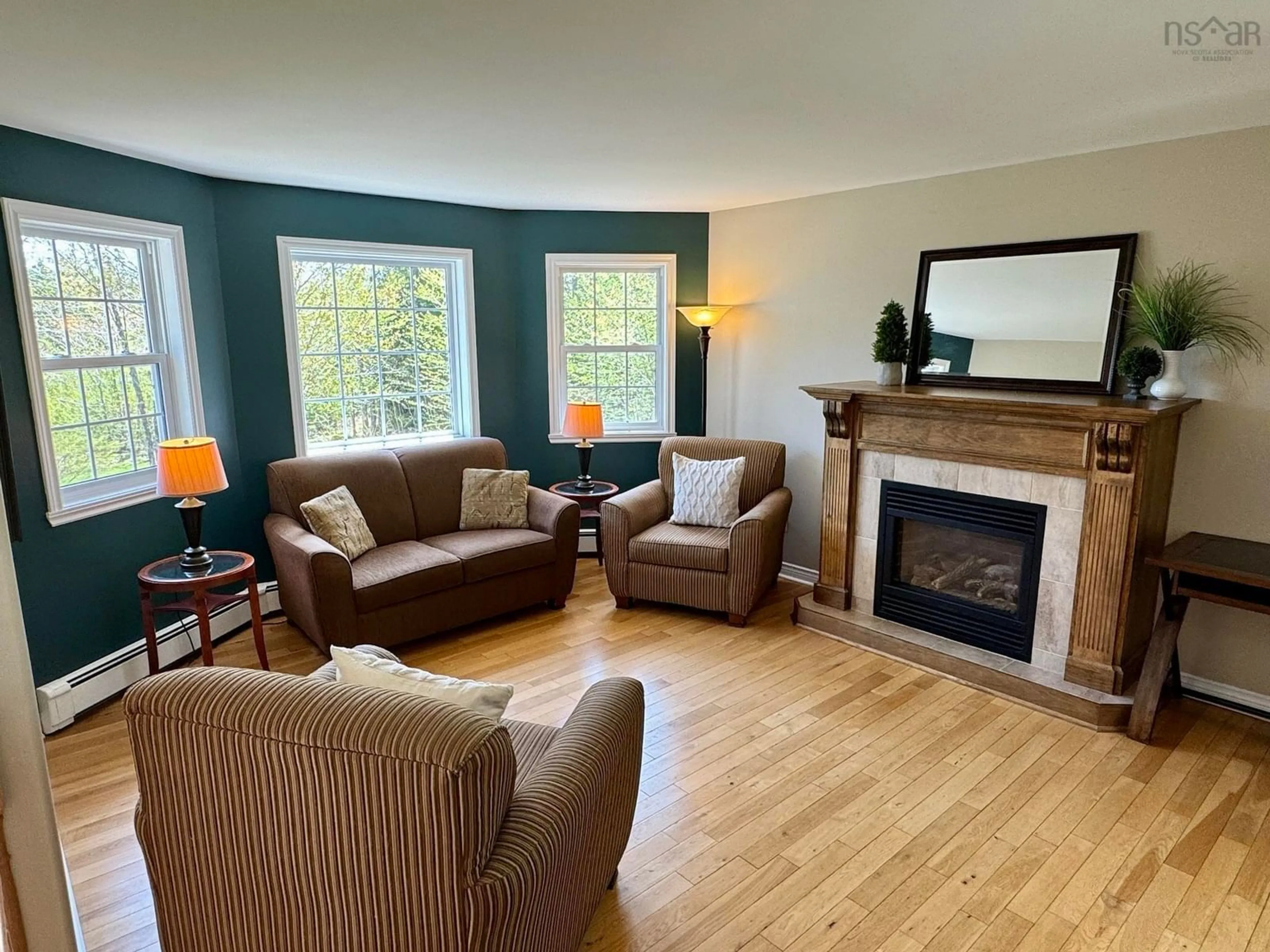 Living room with furniture, wood/laminate floor for 454 Tattenham Cres, Hammonds Plains Nova Scotia B4B 1V3