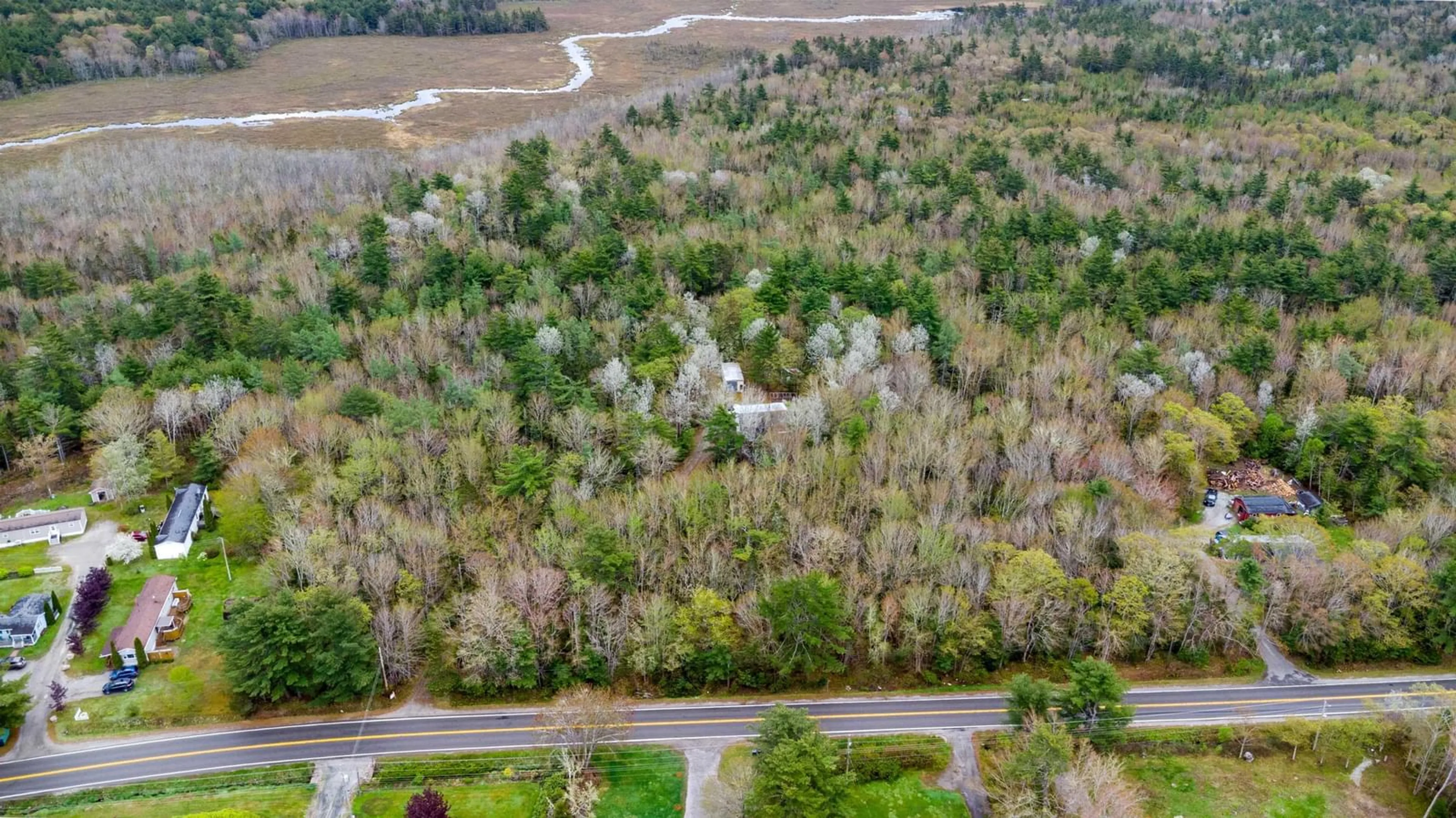 A pic from outside/outdoor area/front of a property/back of a property/a pic from drone, forest/trees view for 830 Woodlawn Dr, Shelburne Nova Scotia B0T 1W0
