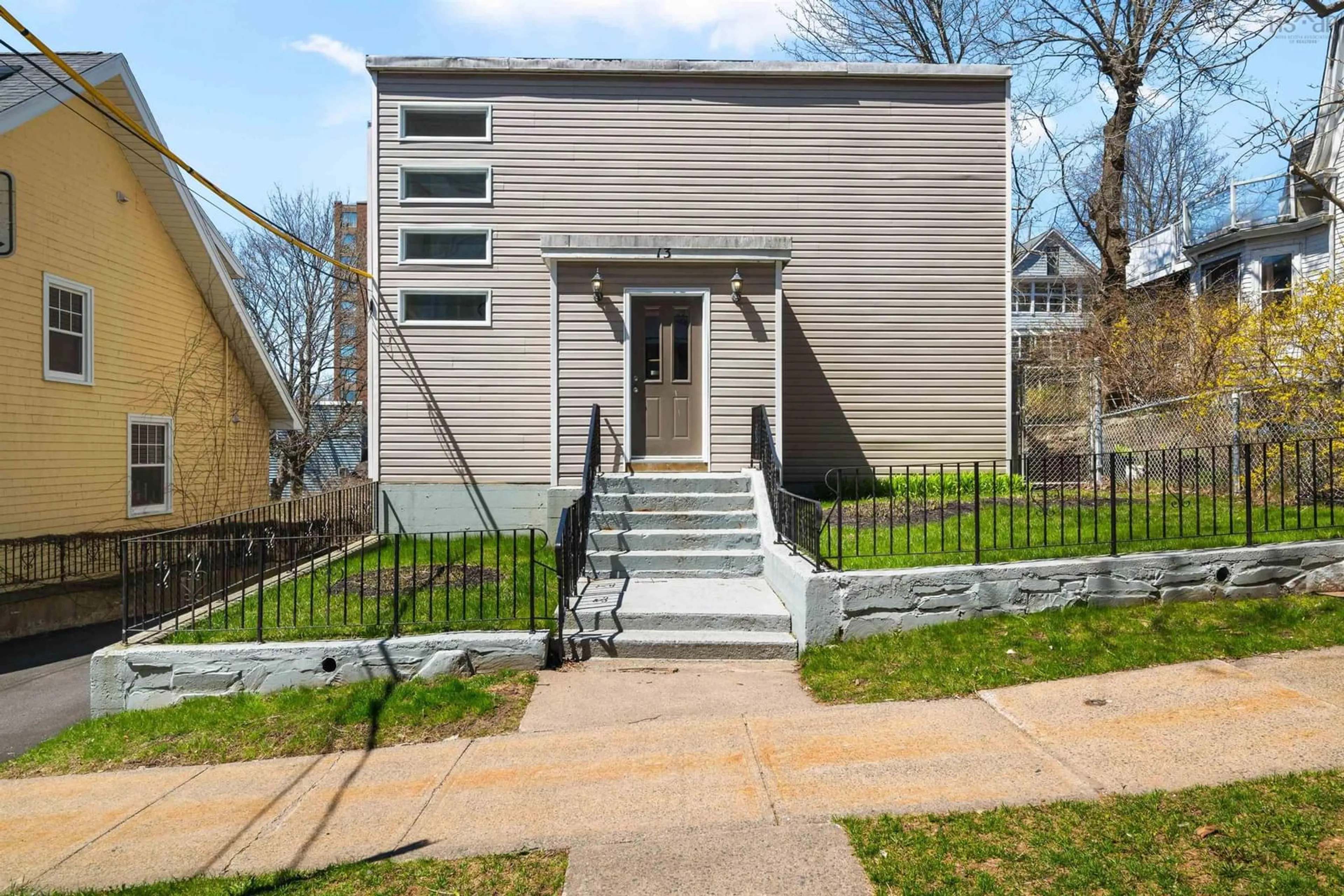 Home with vinyl exterior material, street for 13 North St, Dartmouth Nova Scotia B2Y 1B3