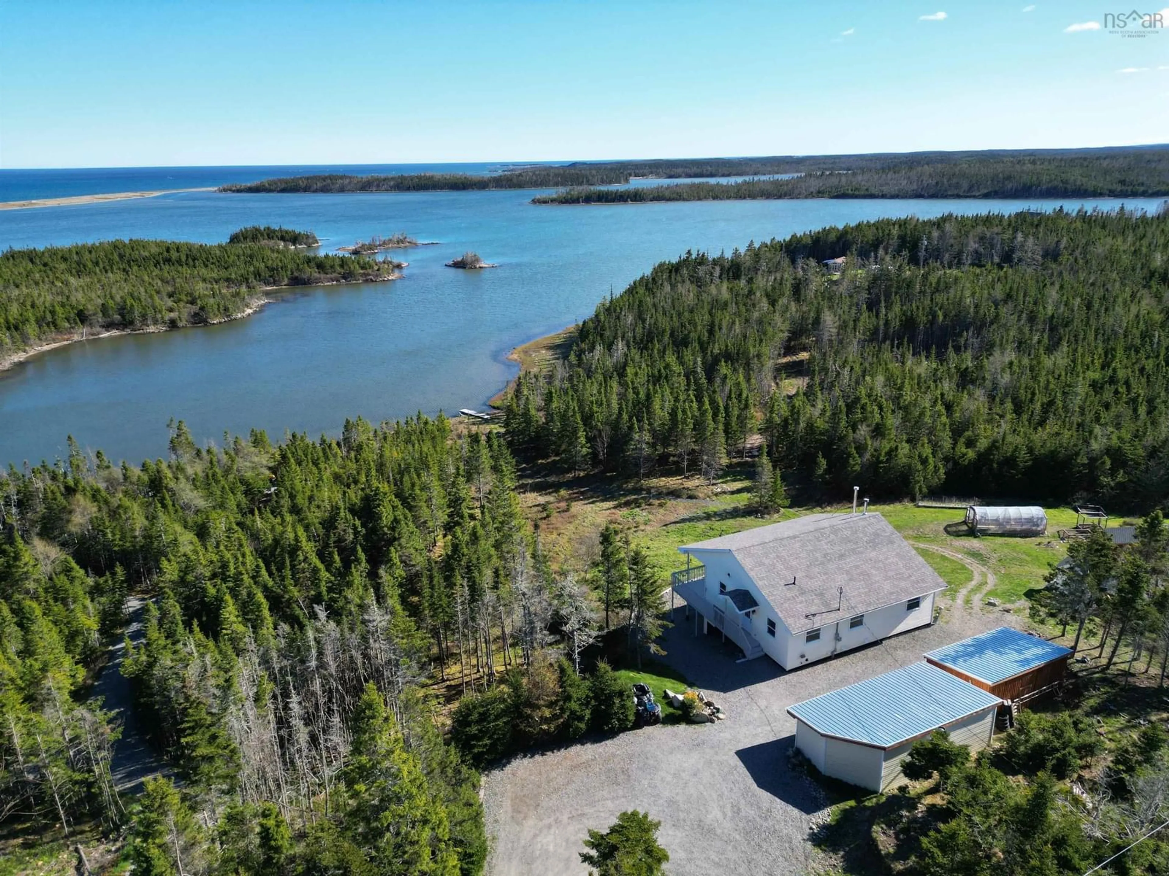 A pic from outside/outdoor area/front of a property/back of a property/a pic from drone, water/lake/river/ocean view for 35 Captains Lane, Gabarus Lake Nova Scotia B1K 2J6