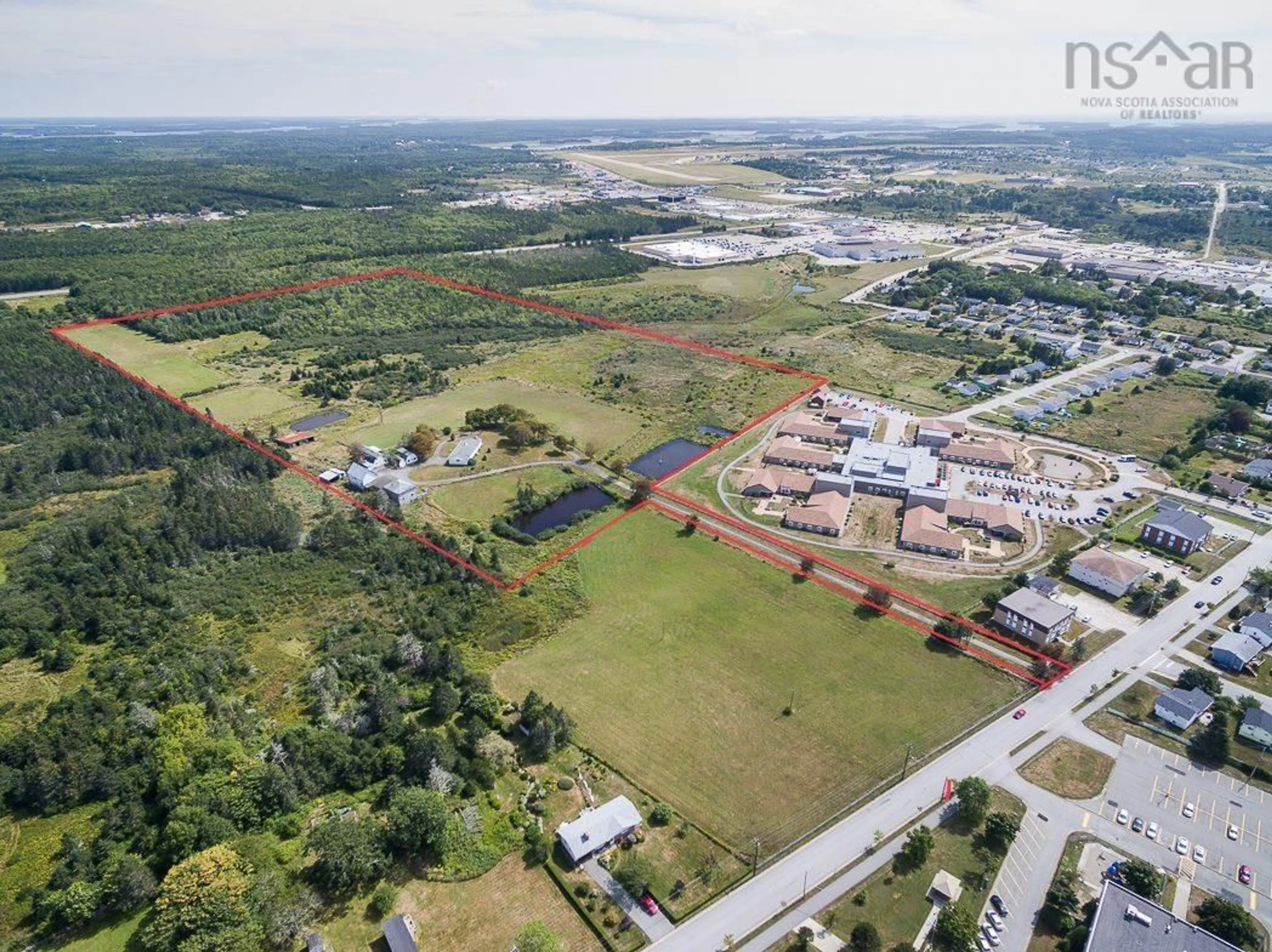 A pic from outside/outdoor area/front of a property/back of a property/a pic from drone, building for 355 Pleasant St, Yarmouth Nova Scotia B5A 2K9
