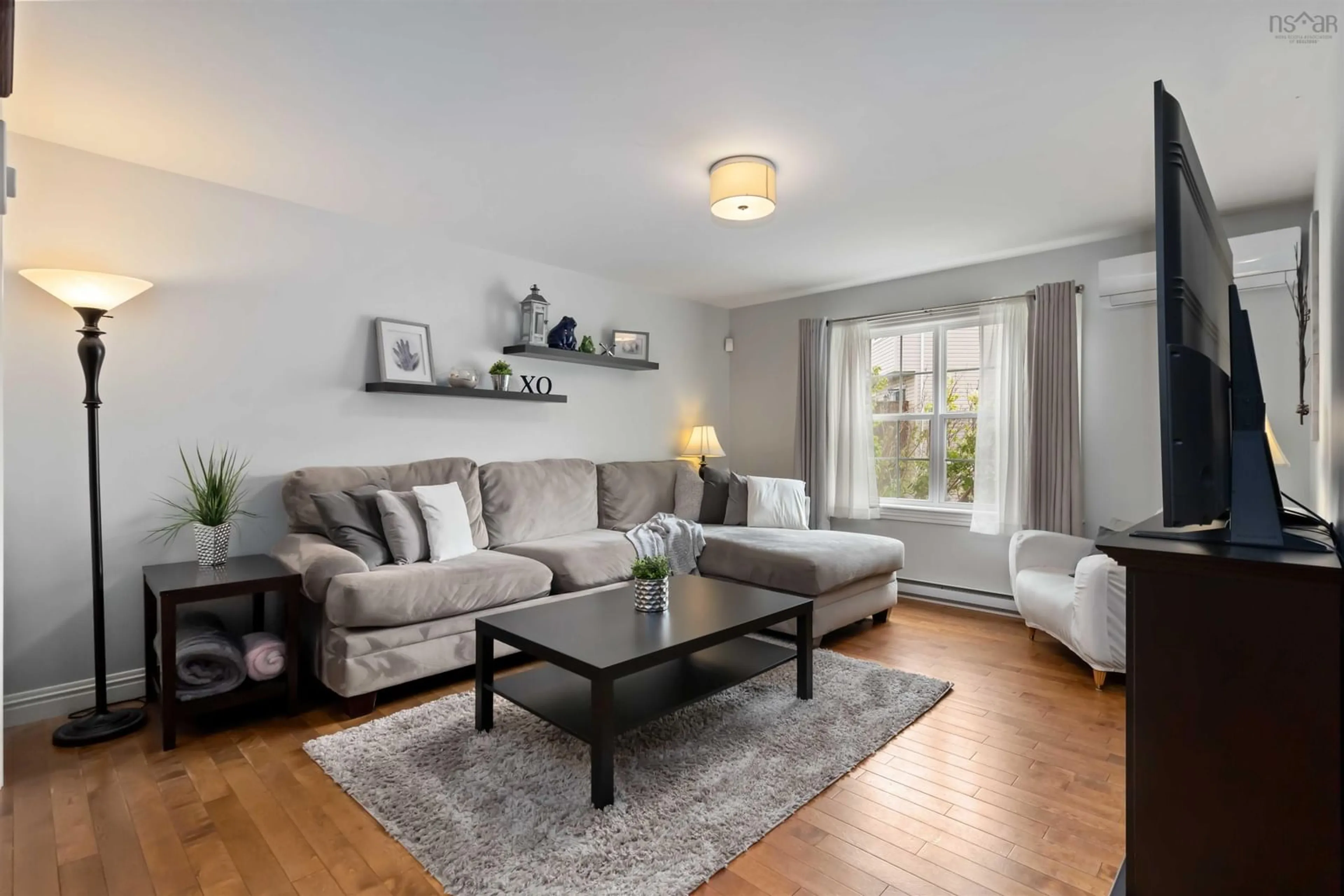 Living room with furniture, wood/laminate floor for 17 Hubleys Dr, Halifax Nova Scotia B3P 1G9