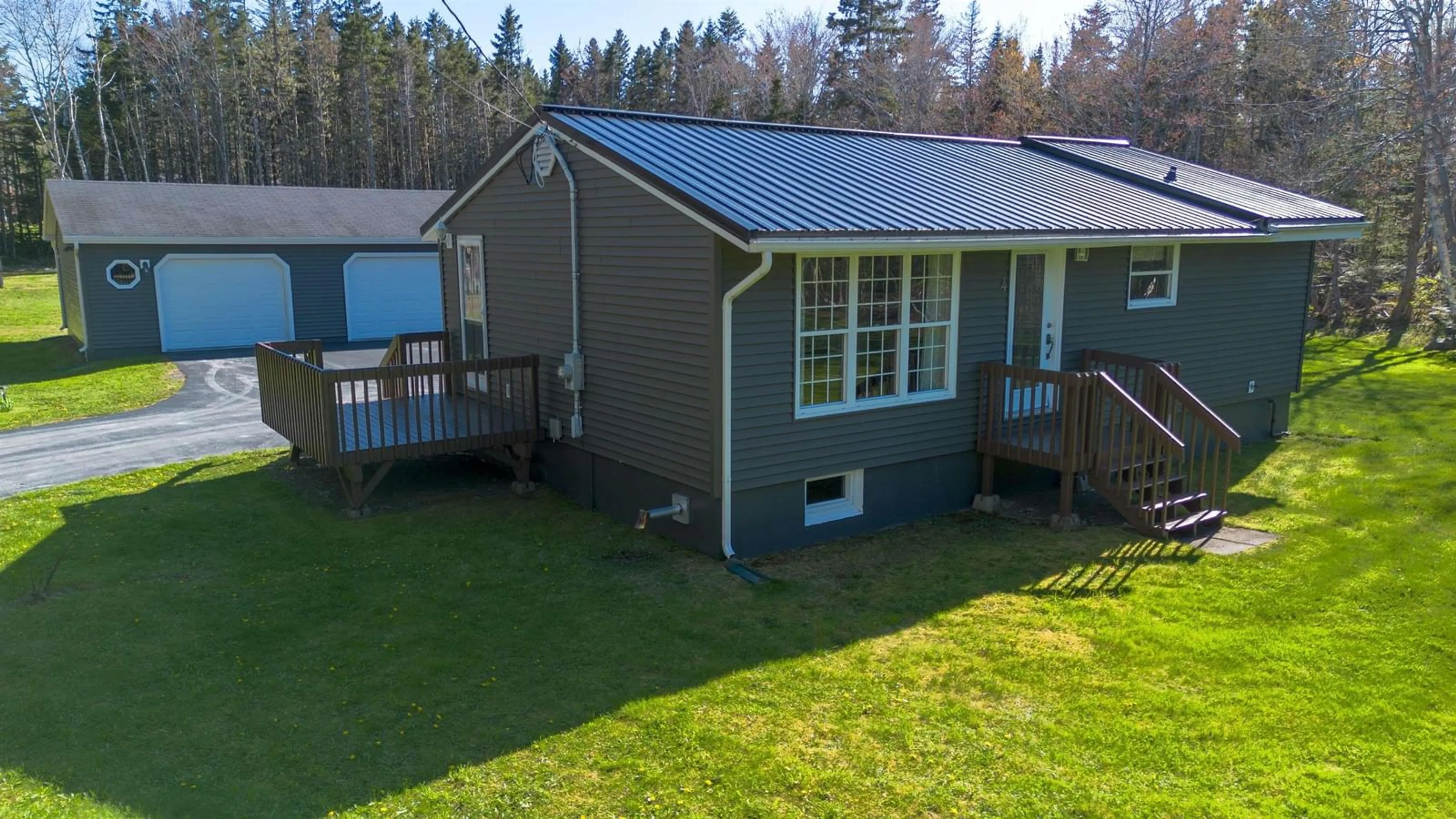 A pic from outside/outdoor area/front of a property/back of a property/a pic from drone, unknown for 4 Macinnis Dr, Millville Nova Scotia B1Y 2H7