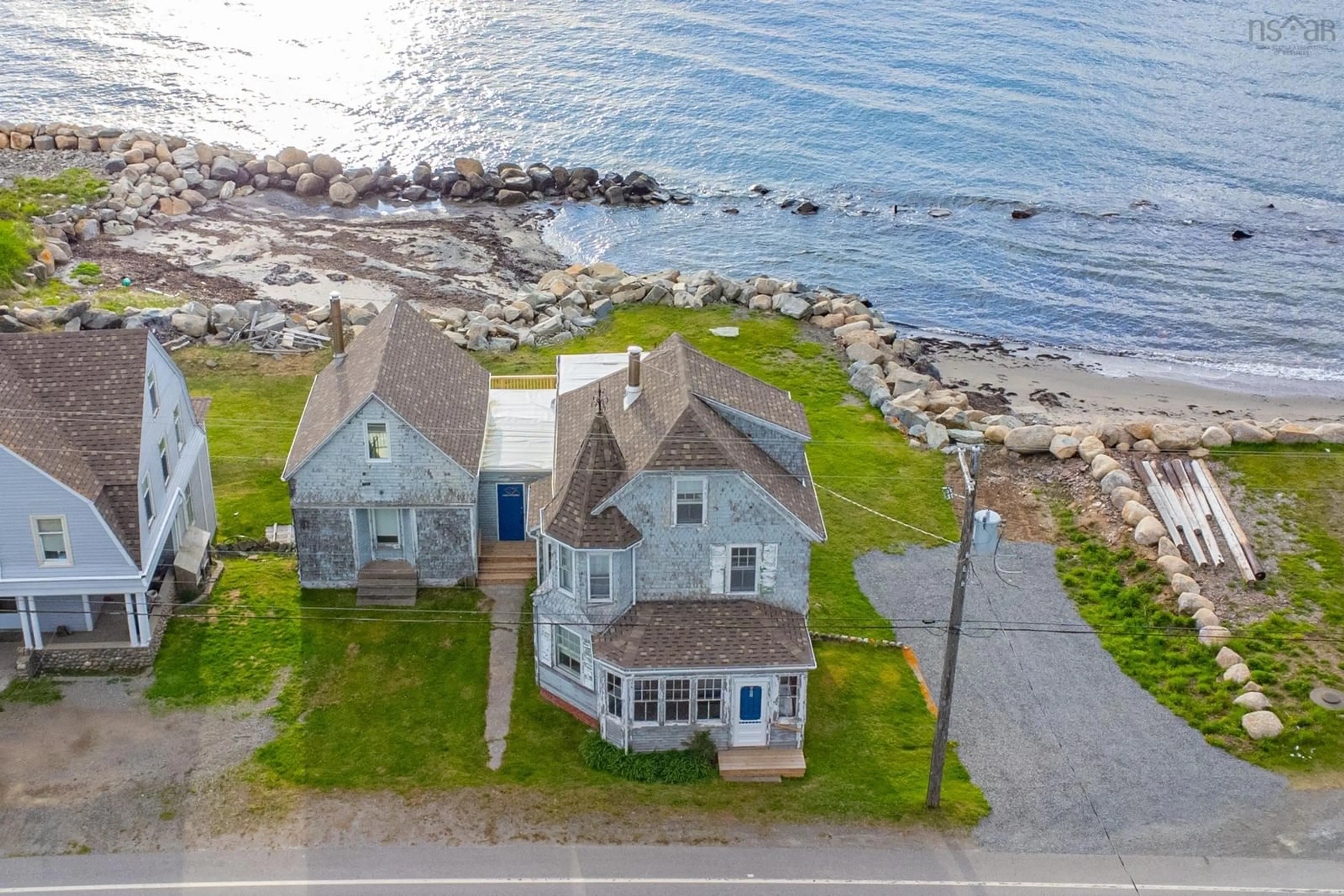 A pic from outside/outdoor area/front of a property/back of a property/a pic from drone, water/lake/river/ocean view for 9105 Highway 1, Meteghan River Nova Scotia B0W 2L0