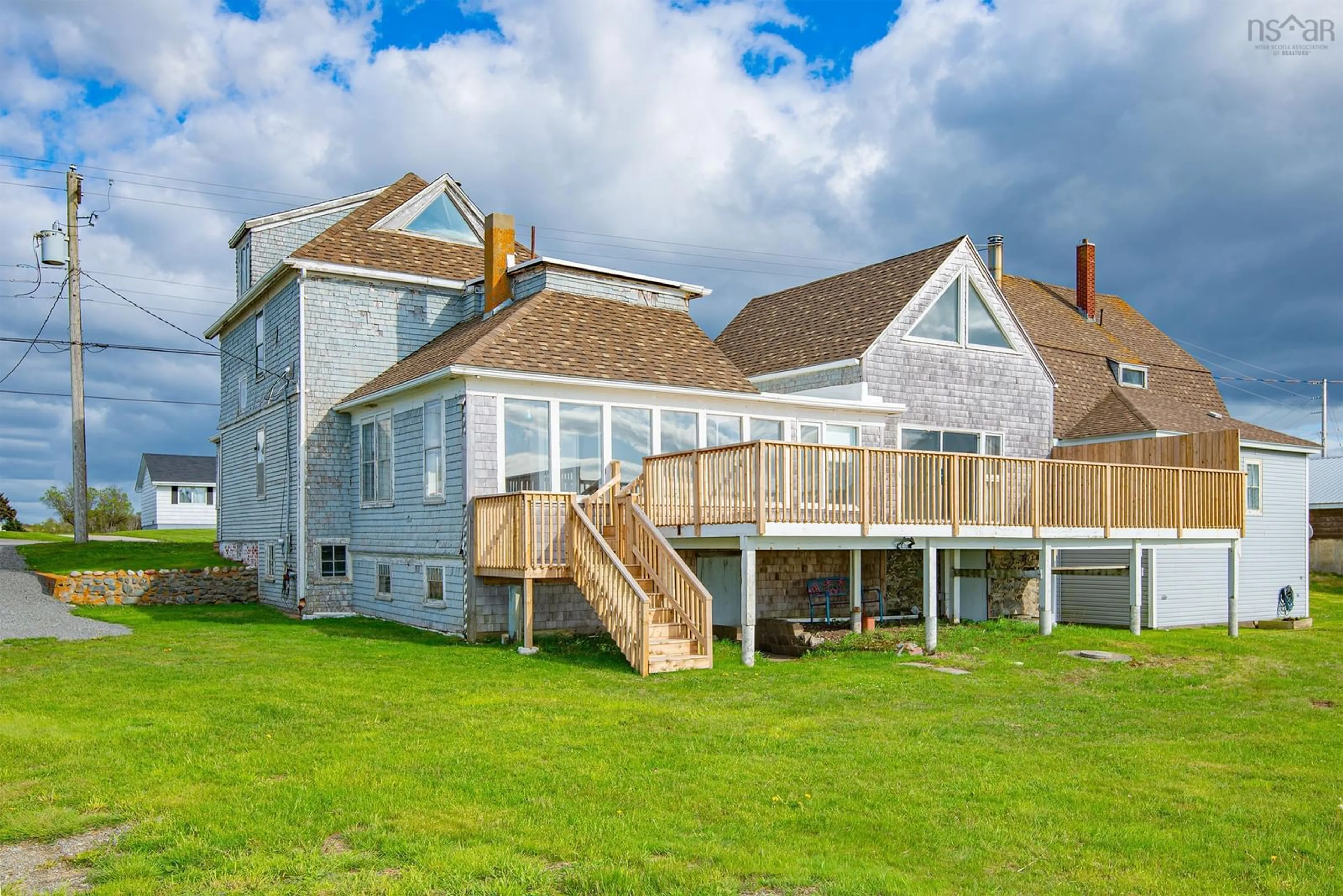 A pic from outside/outdoor area/front of a property/back of a property/a pic from drone, water/lake/river/ocean view for 9105 Highway 1, Meteghan River Nova Scotia B0W 2L0