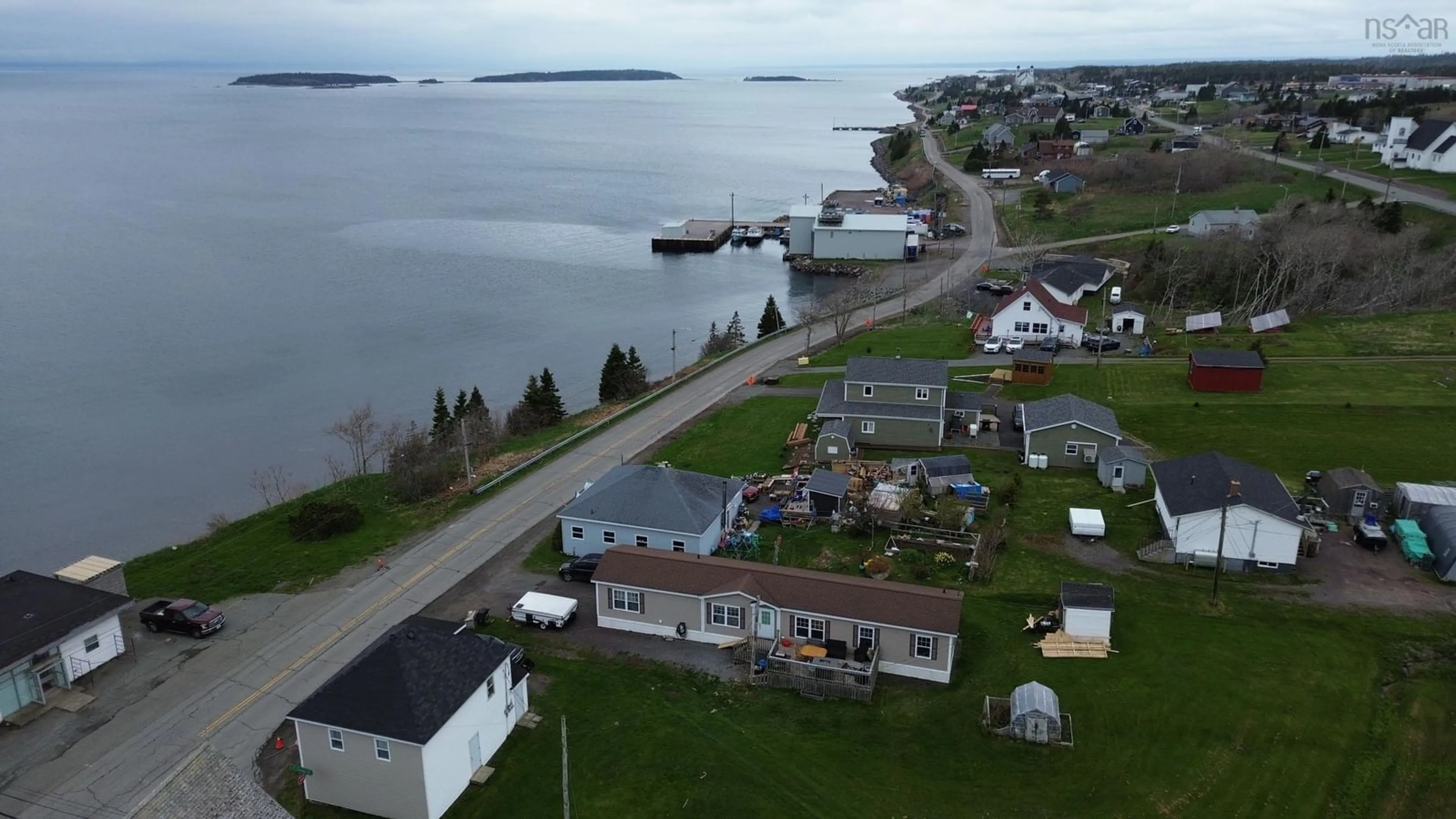 A pic from outside/outdoor area/front of a property/back of a property/a pic from drone, water/lake/river/ocean view for 667 Veterans Memorial Dr, Arichat Nova Scotia B0E 1A0