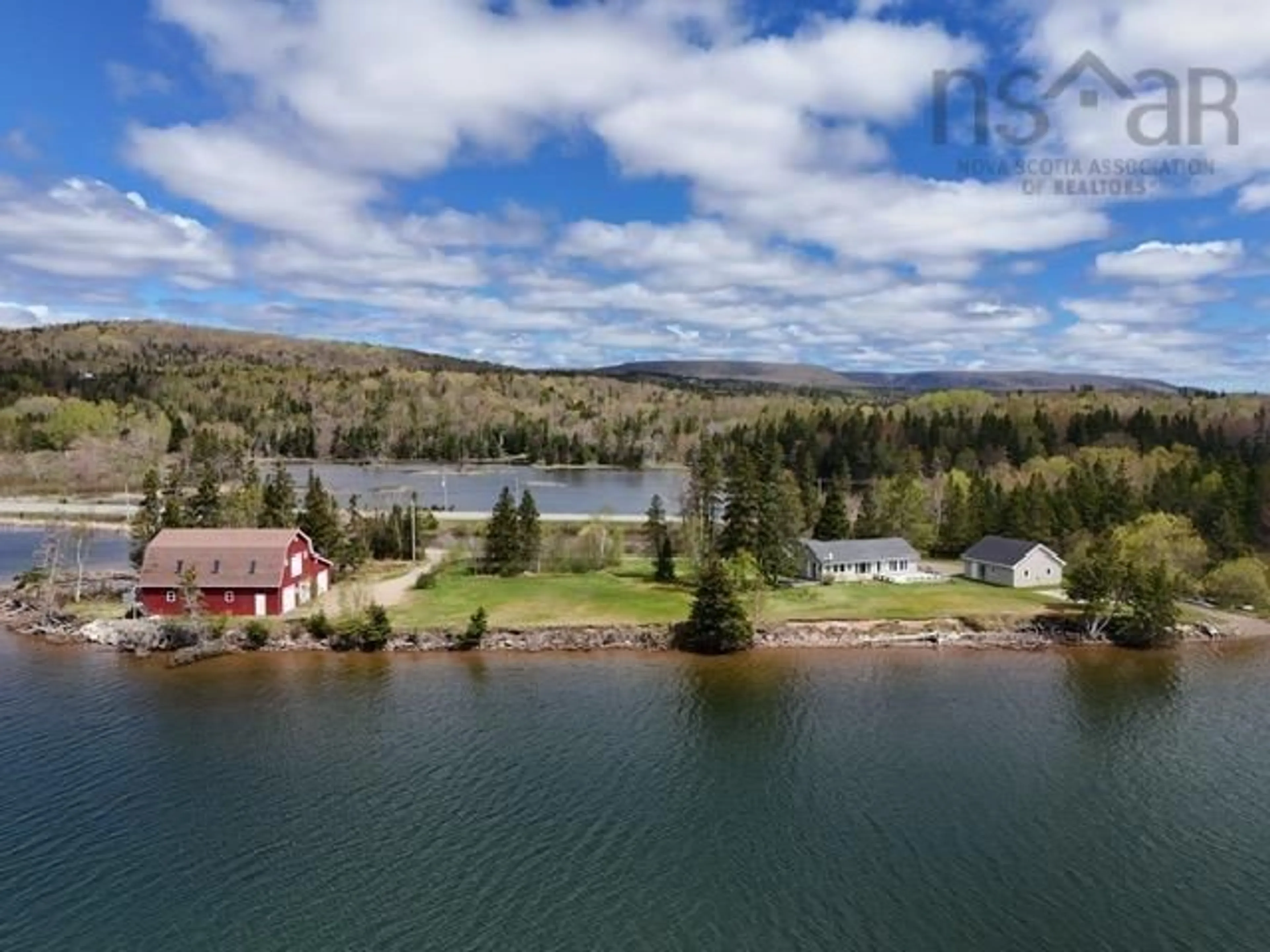 A pic from outside/outdoor area/front of a property/back of a property/a pic from drone, water/lake/river/ocean view for 9917 105 Hwy, Nyanza Nova Scotia B0E 1B0