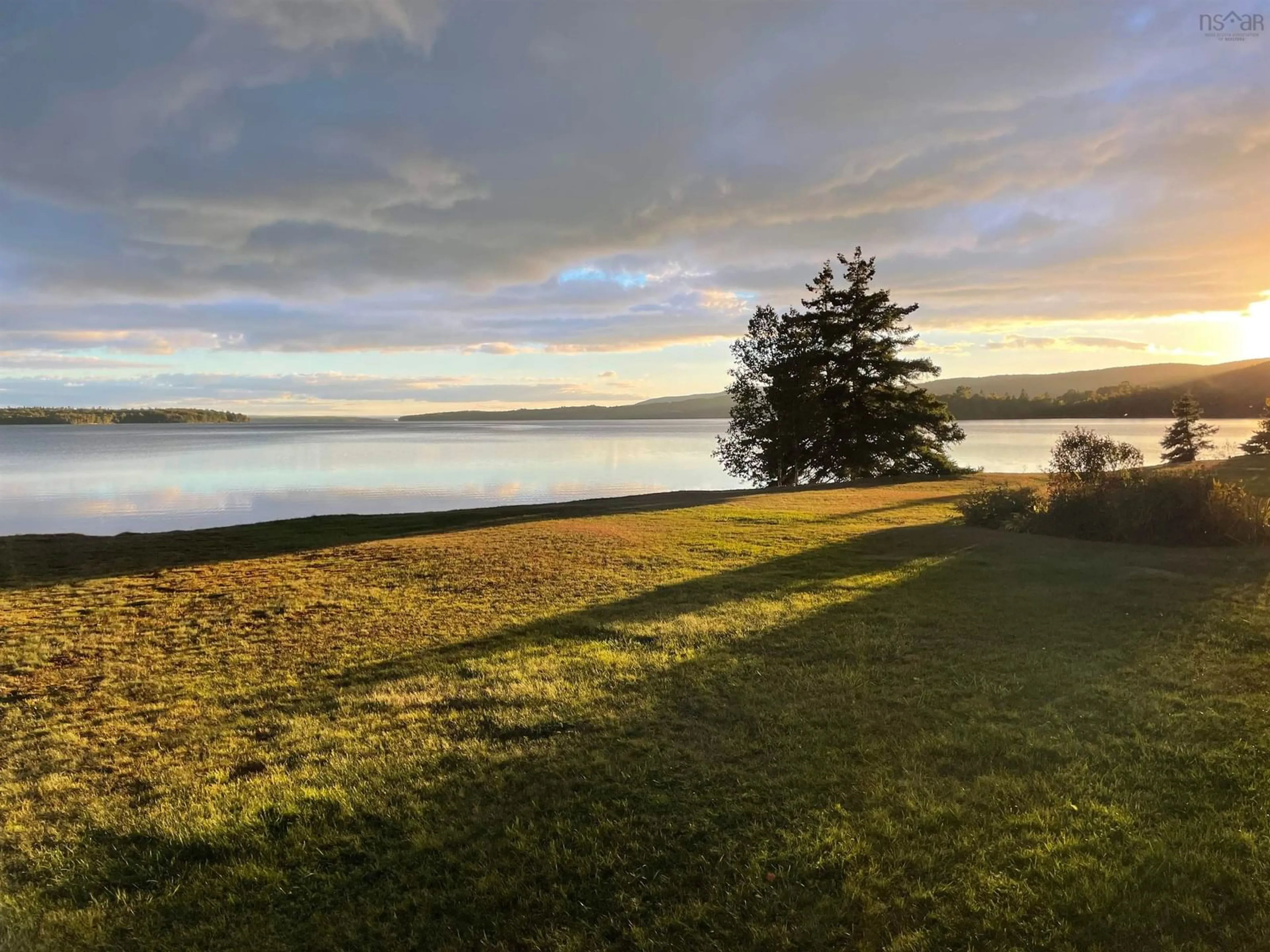 A pic from outside/outdoor area/front of a property/back of a property/a pic from drone, water/lake/river/ocean view for 9917 105 Hwy, Nyanza Nova Scotia B0E 1B0