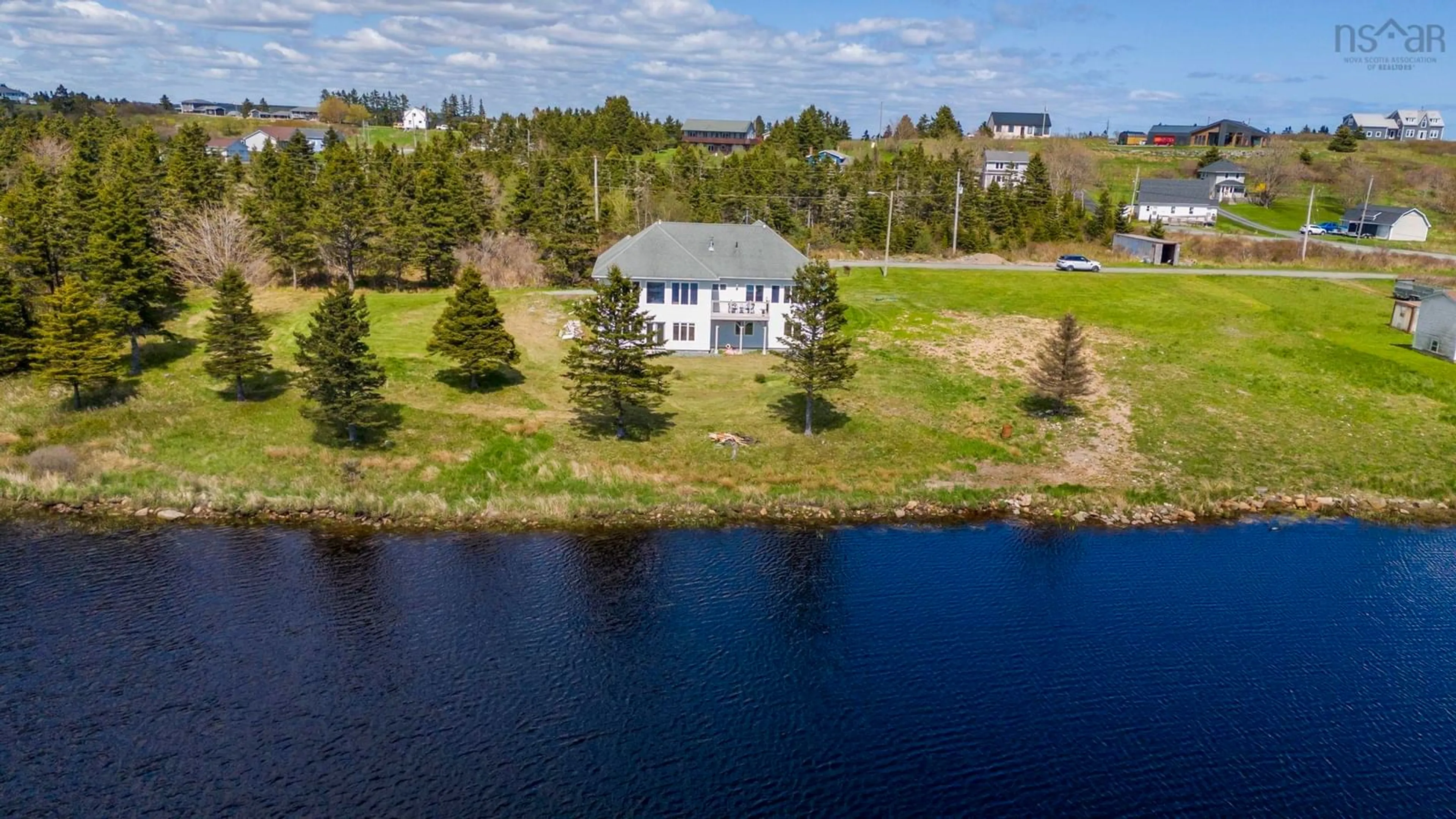 A pic from outside/outdoor area/front of a property/back of a property/a pic from drone, water/lake/river/ocean view for 1480 Cow Bay Rd, Cow Bay Nova Scotia B3G 1L3