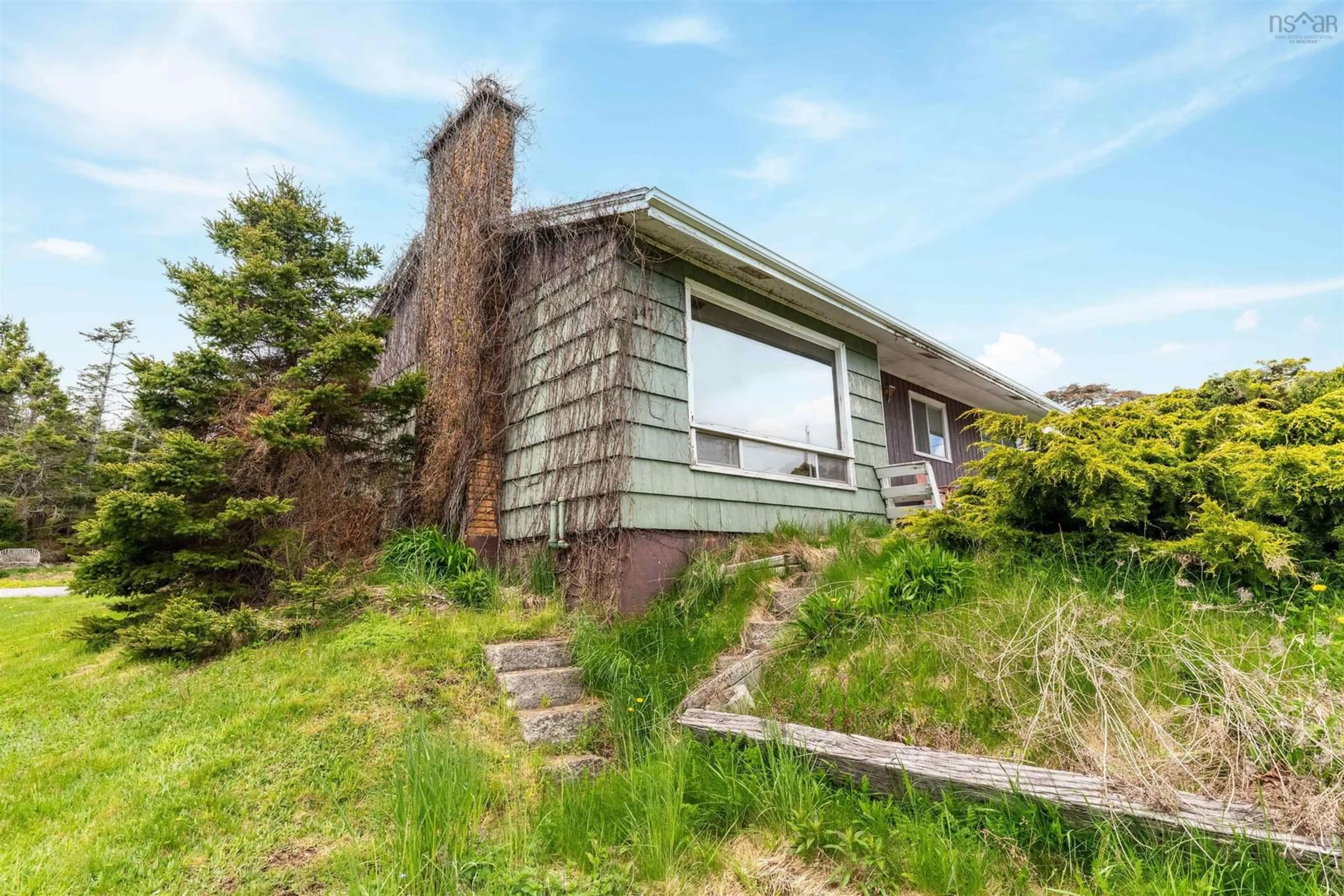 A pic from outside/outdoor area/front of a property/back of a property/a pic from drone, building for 2447 Crowell Rd, East Lawrencetown Nova Scotia B2Z 1P5