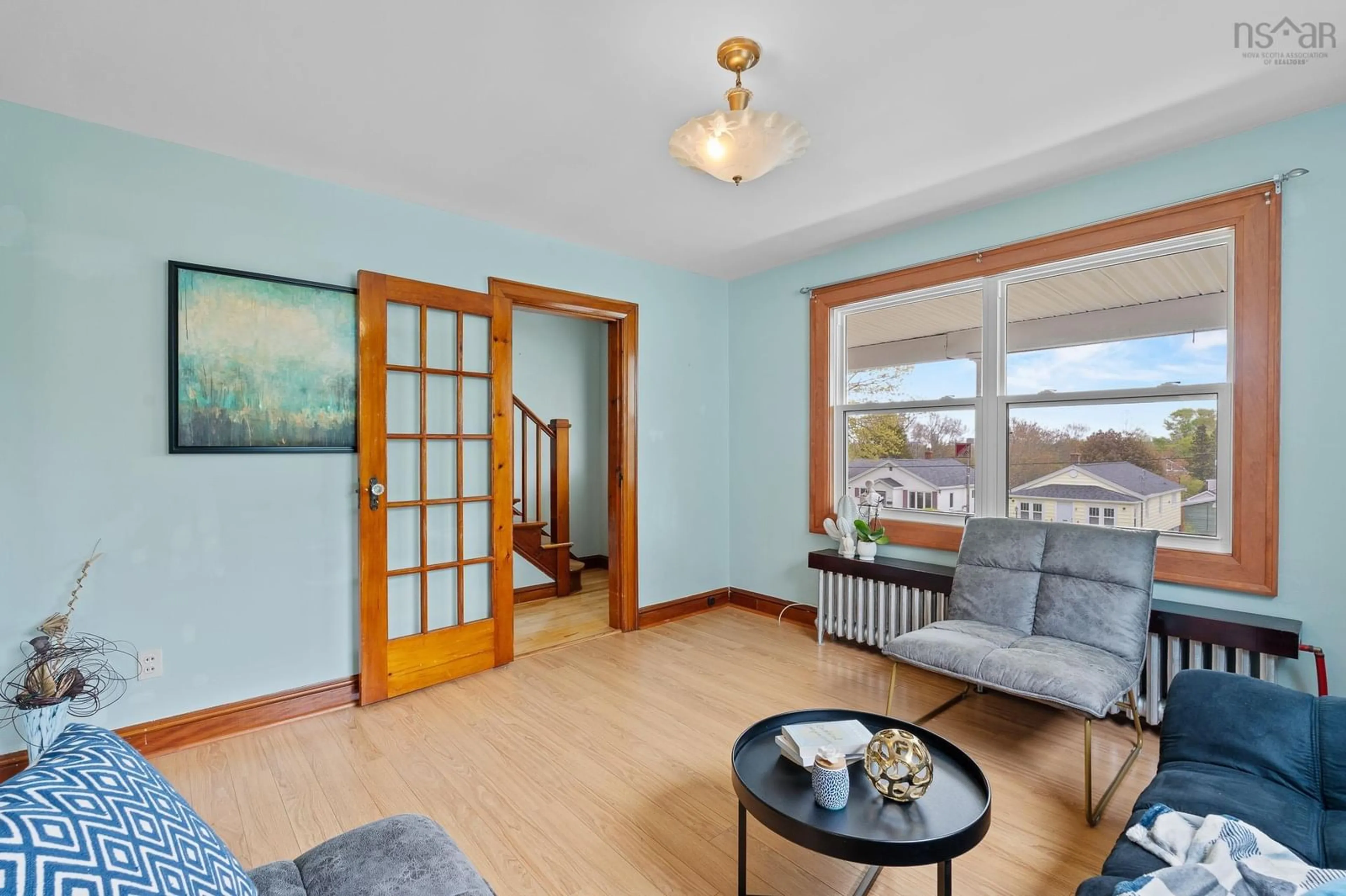 Living room with furniture, wood/laminate floor for 12 Margate Dr, Spryfield Nova Scotia B3P 1N6