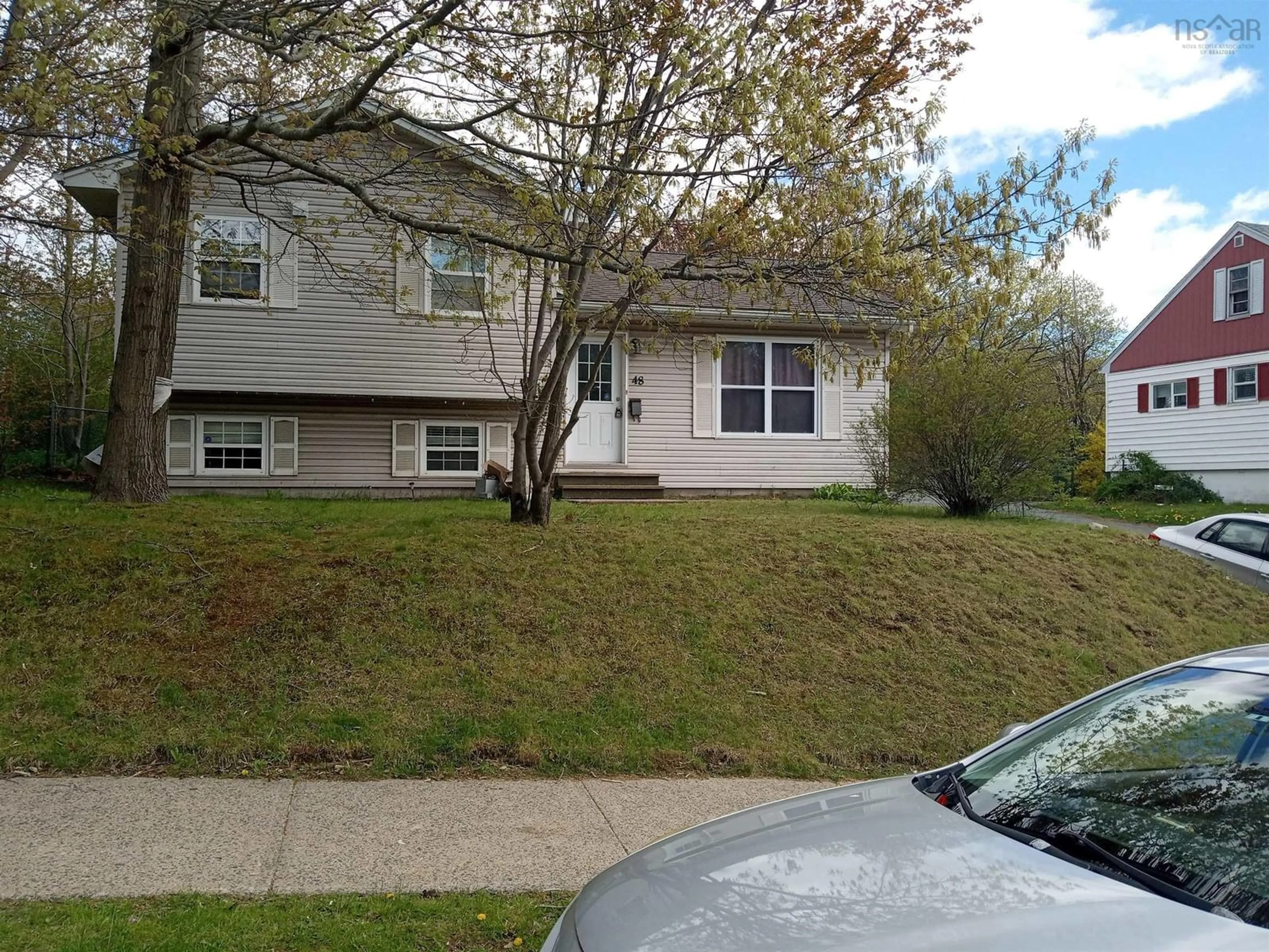 Home with vinyl exterior material, street for 48 Primrose St, Dartmouth Nova Scotia B3A 4C5