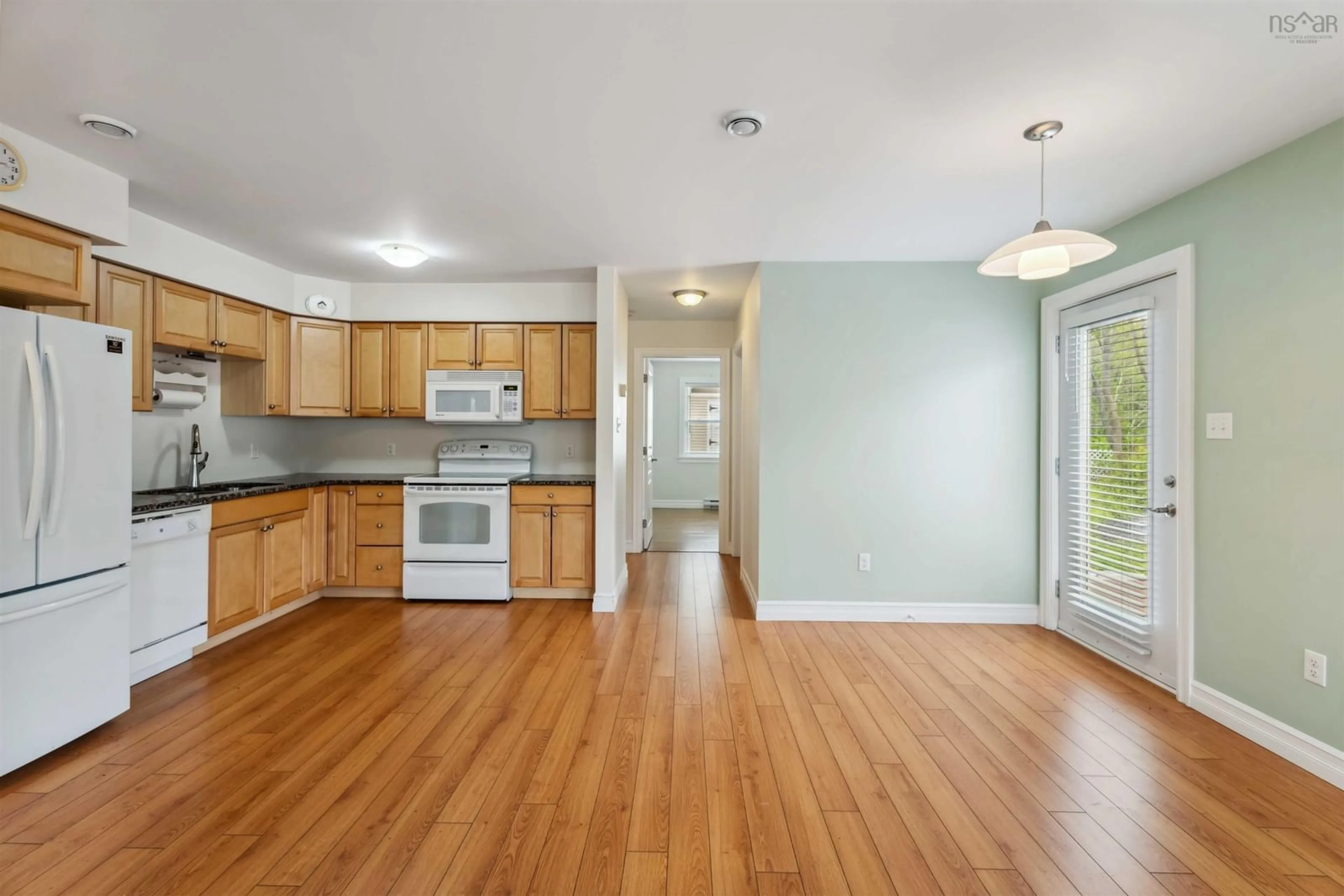 Open concept kitchen, wood/laminate floor for 9654 Commercial St, New Minas Nova Scotia B4N 3G4