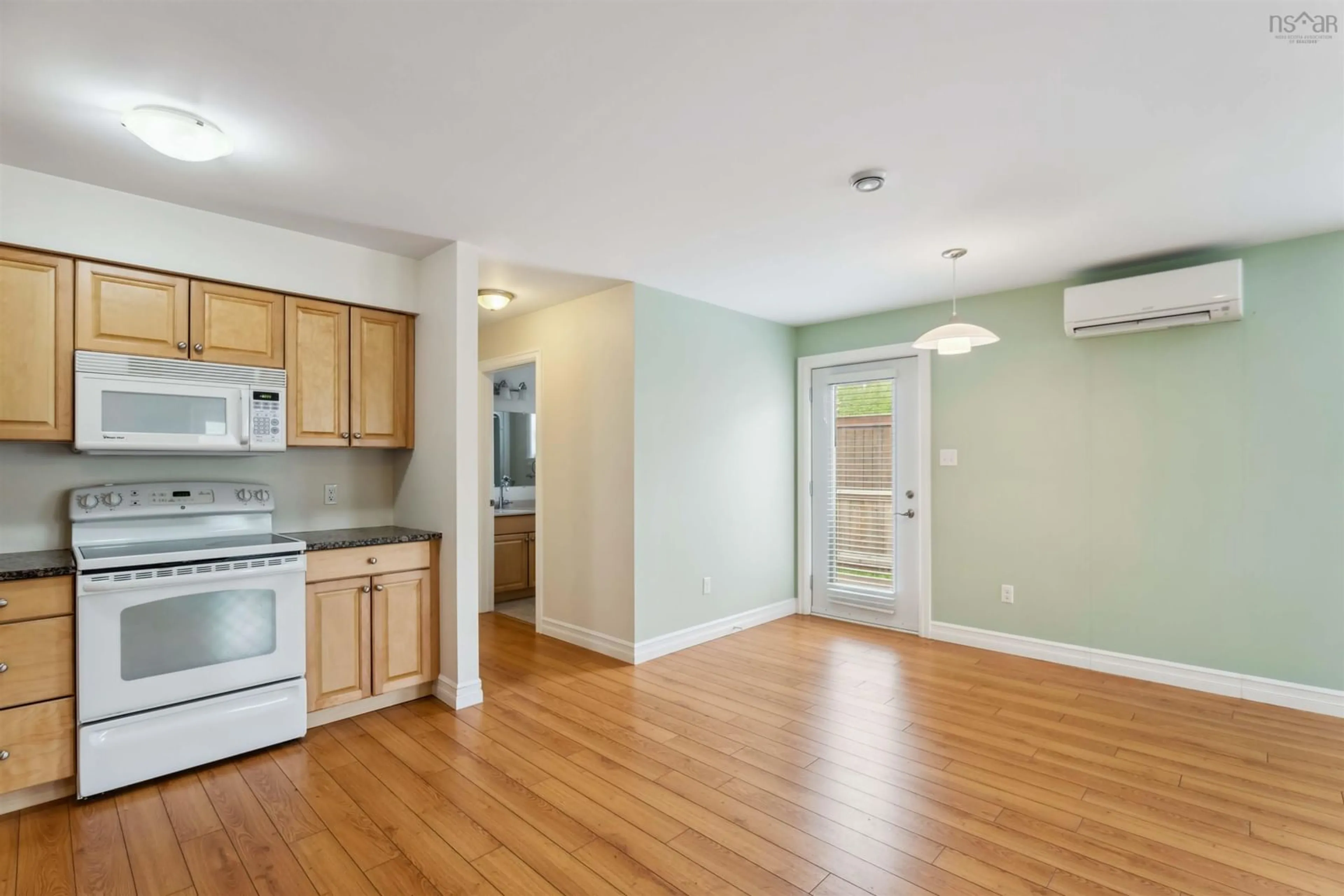 Open concept kitchen, wood/laminate floor for 9654 Commercial St, New Minas Nova Scotia B4N 3G4