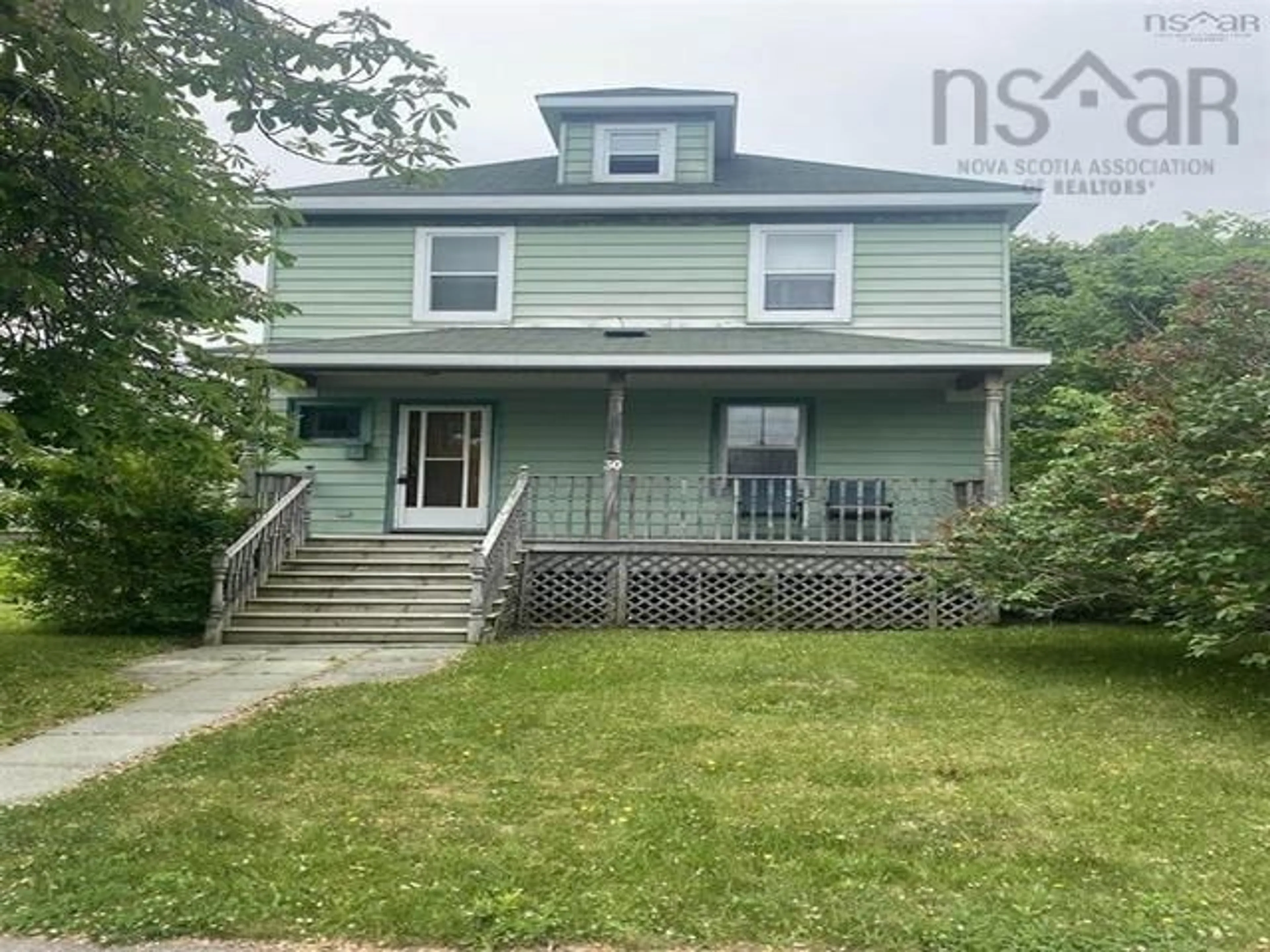 Home with vinyl exterior material, street for 30 Beacon St, North Sydney Nova Scotia B2A 1P9