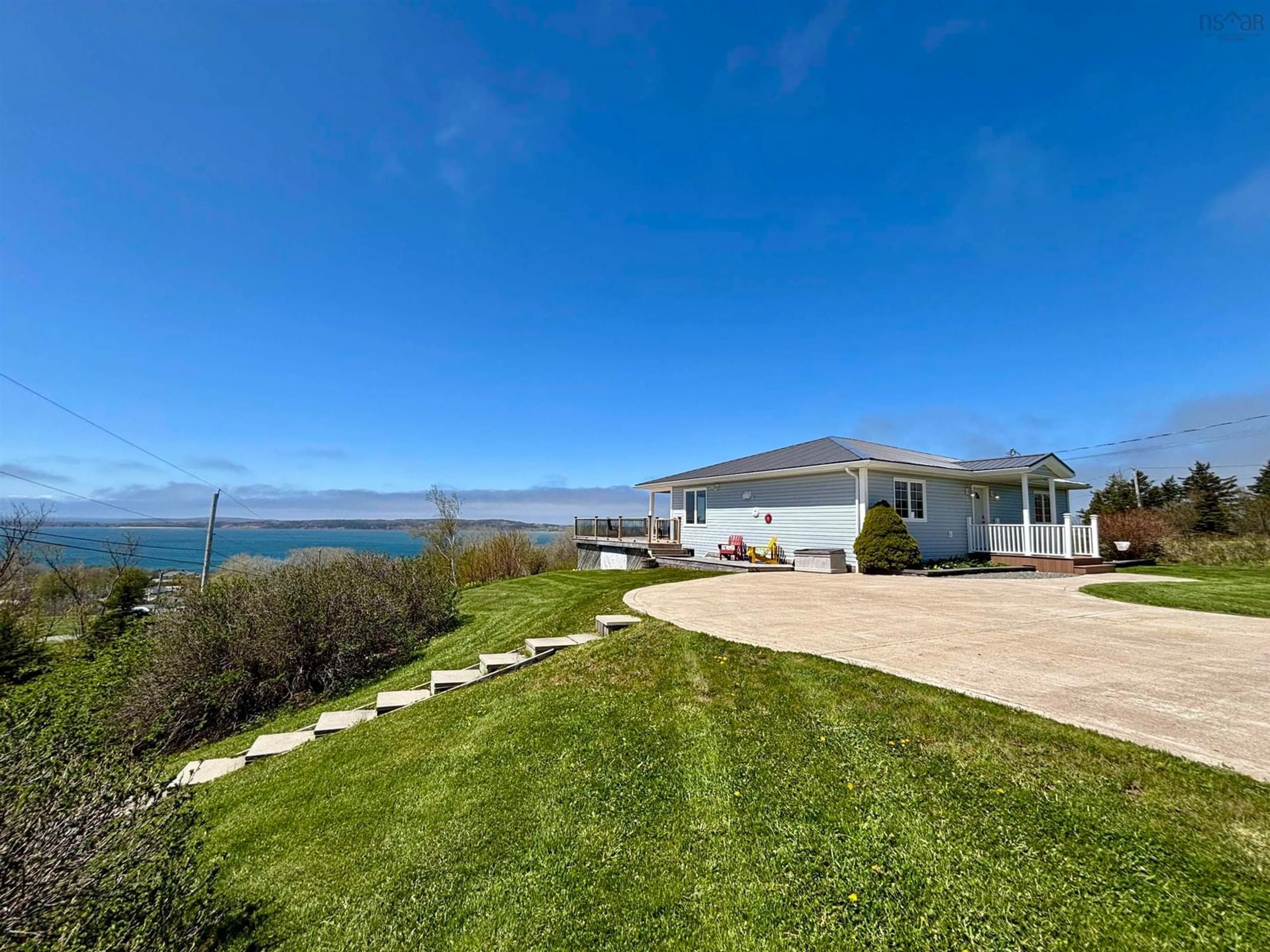 A pic from outside/outdoor area/front of a property/back of a property/a pic from drone, water/lake/river/ocean view for 147 Treuburg Lane, Port Hood Nova Scotia B0E 2W0