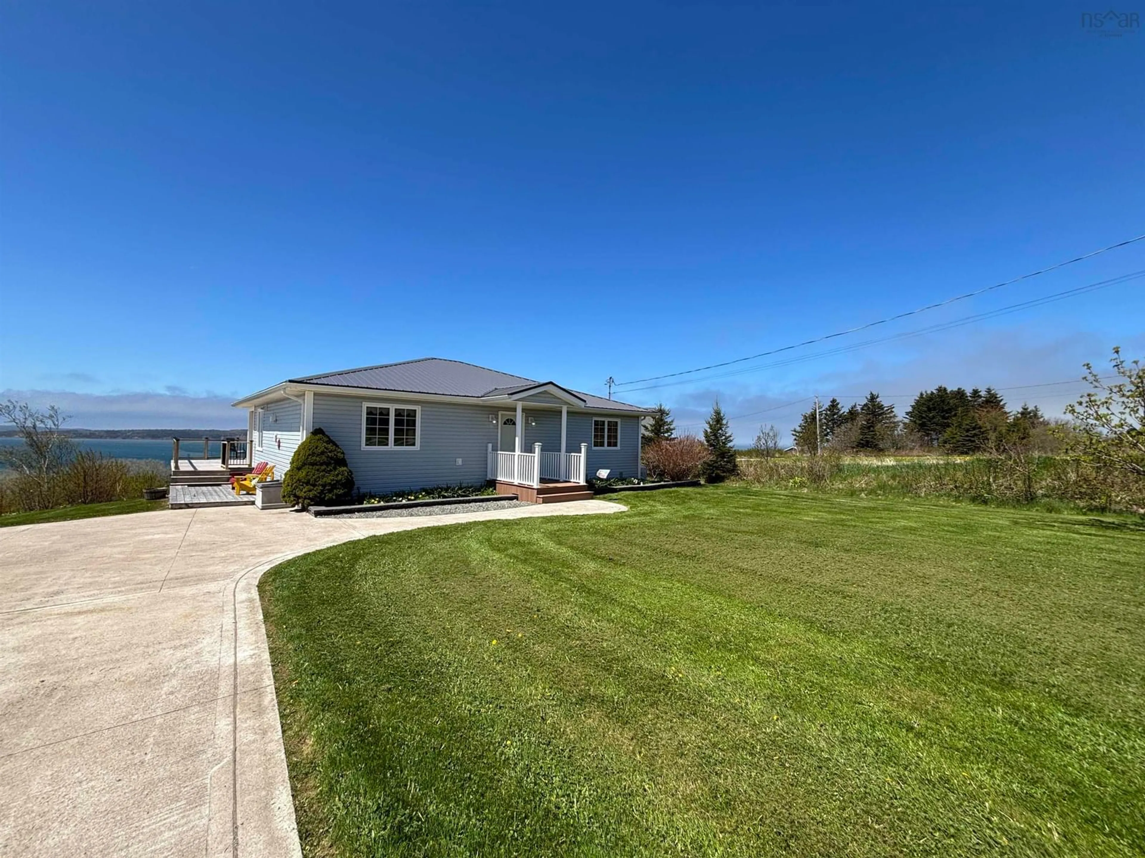 A pic from outside/outdoor area/front of a property/back of a property/a pic from drone, water/lake/river/ocean view for 147 Treuburg Lane, Port Hood Nova Scotia B0E 2W0