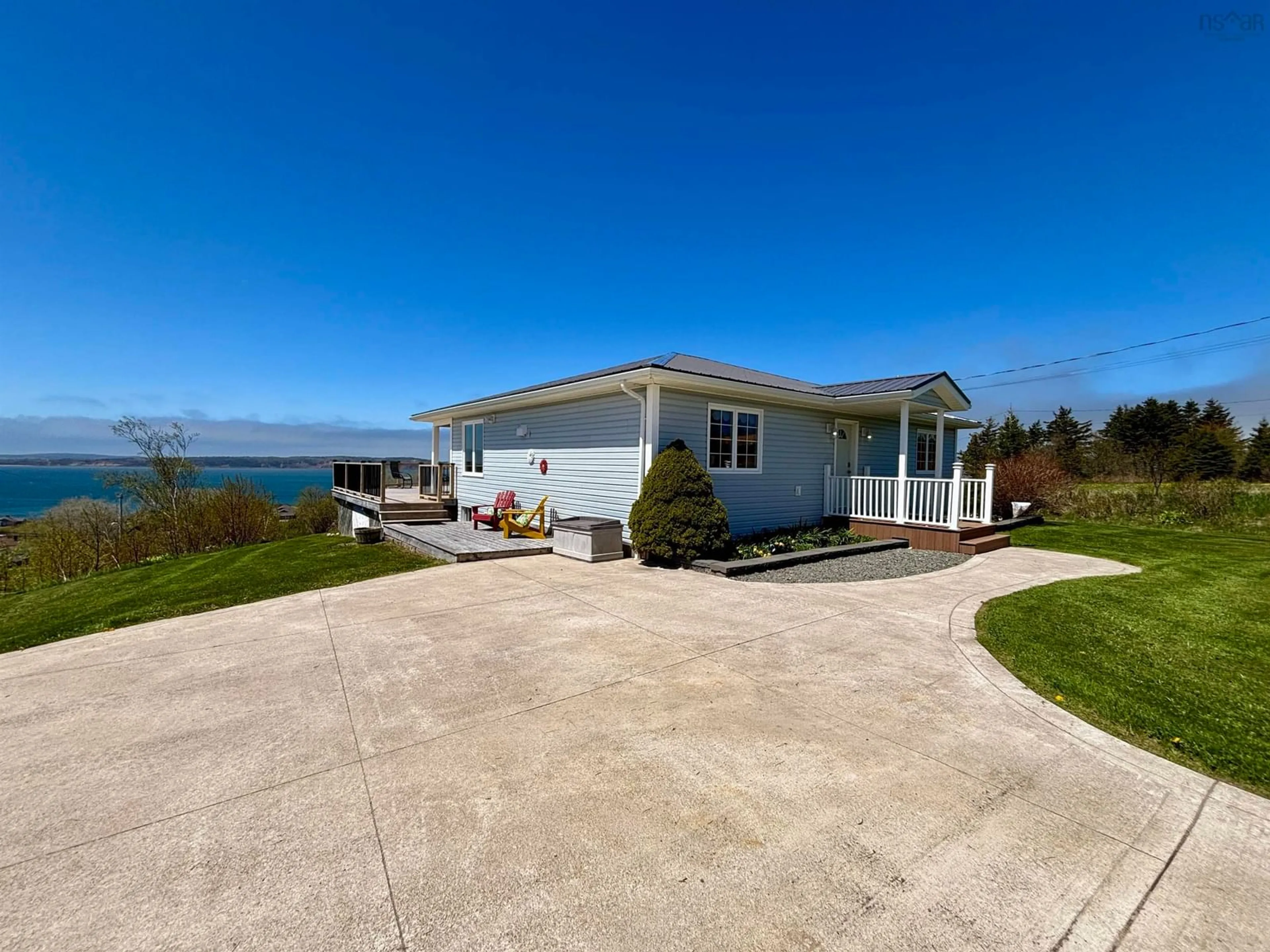 A pic from outside/outdoor area/front of a property/back of a property/a pic from drone, water/lake/river/ocean view for 147 Treuburg Lane, Port Hood Nova Scotia B0E 2W0