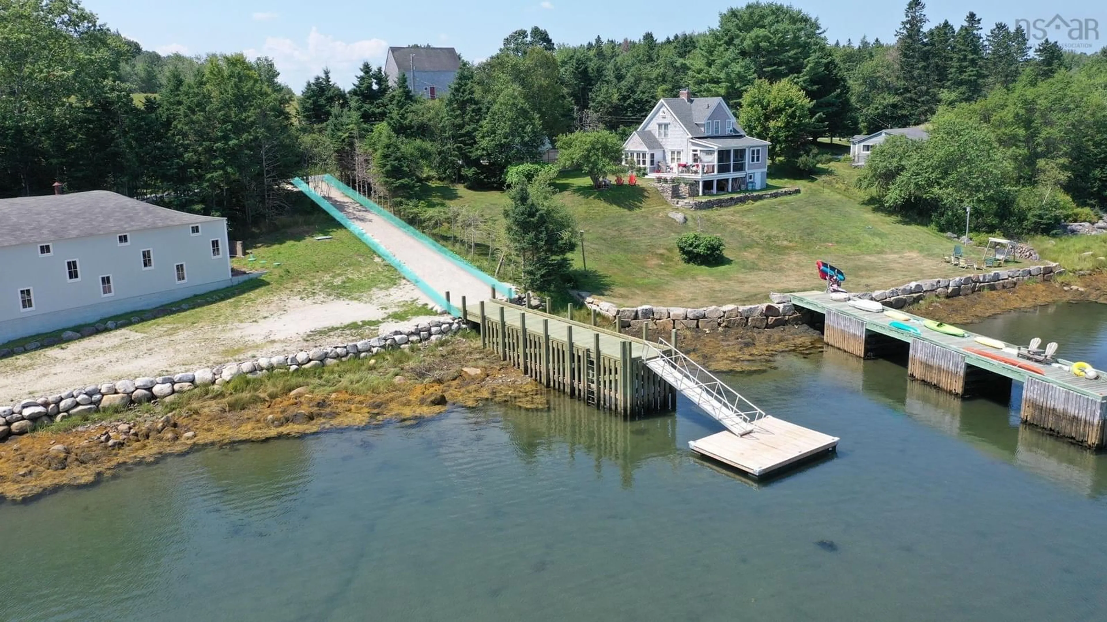 A pic from outside/outdoor area/front of a property/back of a property/a pic from drone, water/lake/river/ocean view for 24 Oak Hill Lane, Marriott's Cove Nova Scotia B0J 1K0