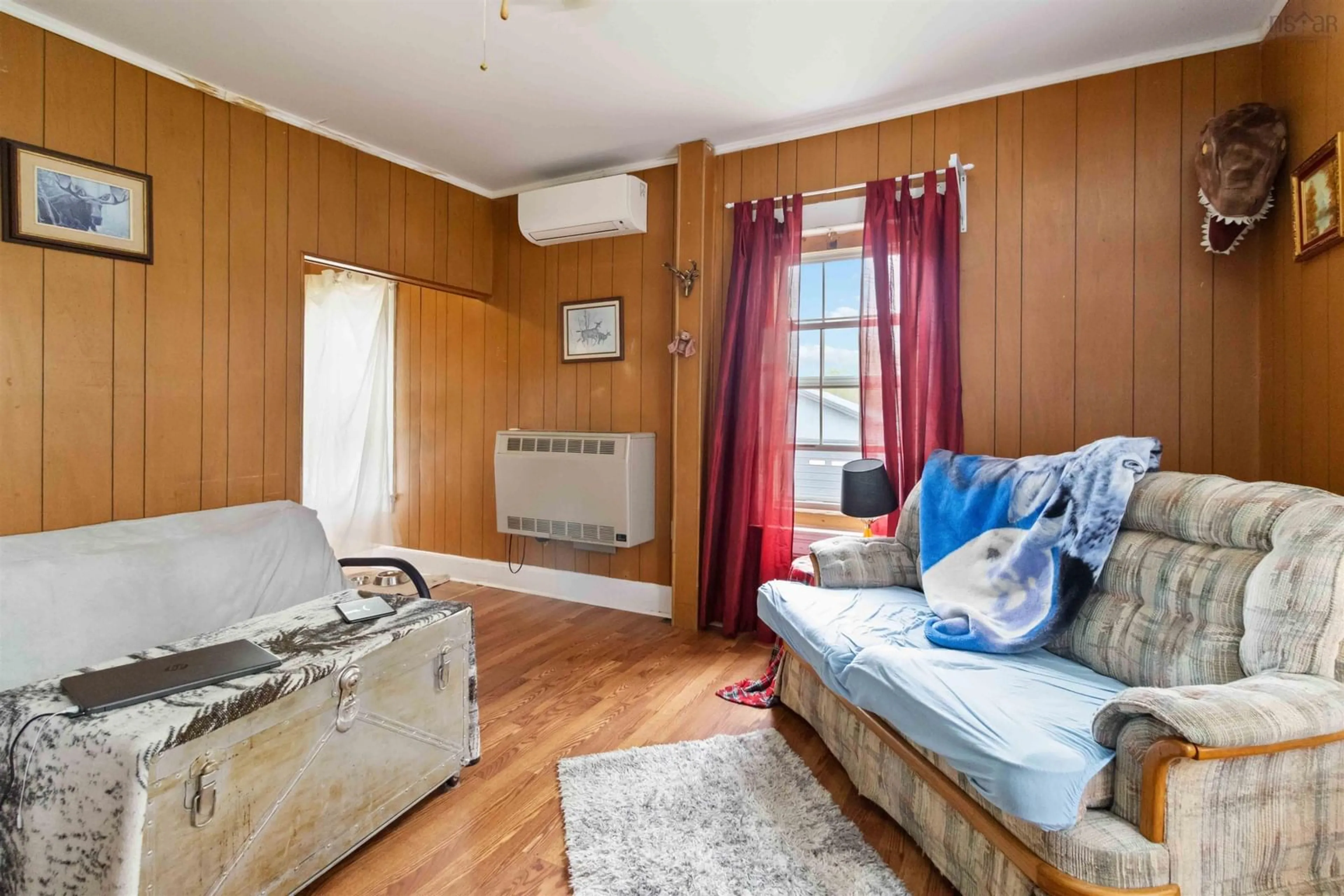 Living room with furniture, wood/laminate floor for 4912 Highway 10, New Germany Nova Scotia B0R 1E0