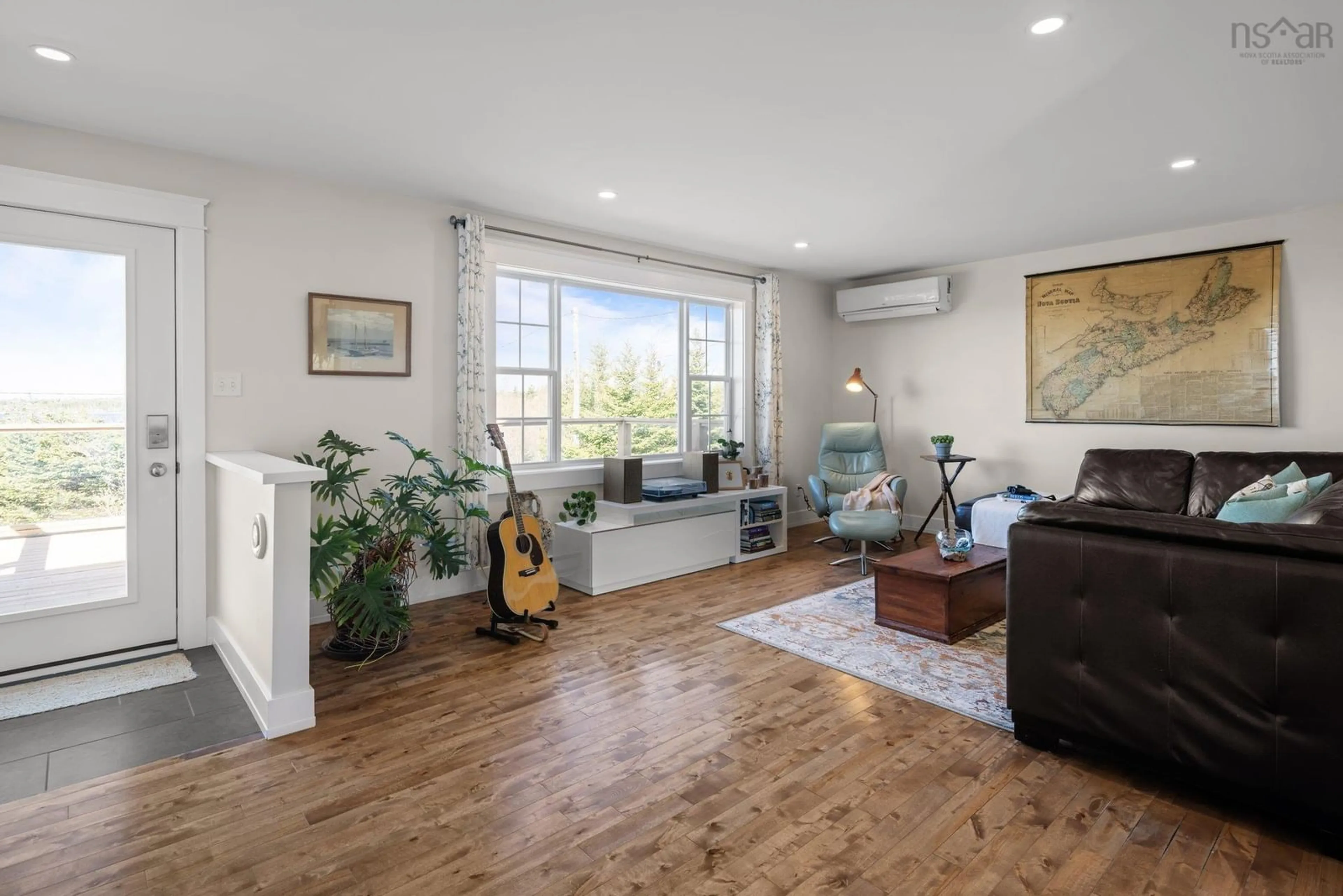 Living room with furniture, wood/laminate floor for 265 Leslie Rd, East Lawrencetown Nova Scotia B2Z 1T4