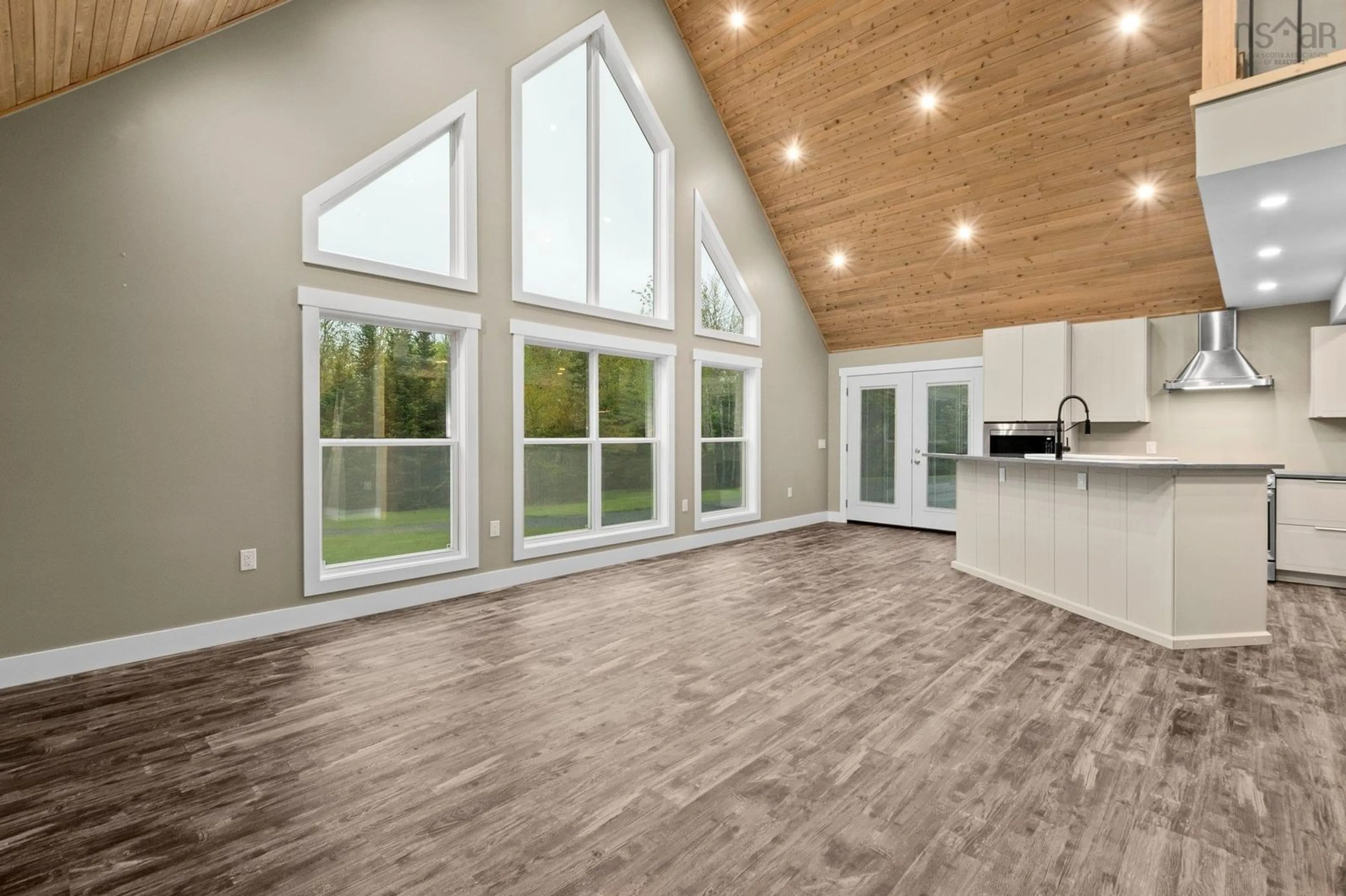 Open concept kitchen, wood/laminate floor for 660 St Andrews River Rd, Shubenacadie East Nova Scotia B0N 2H0