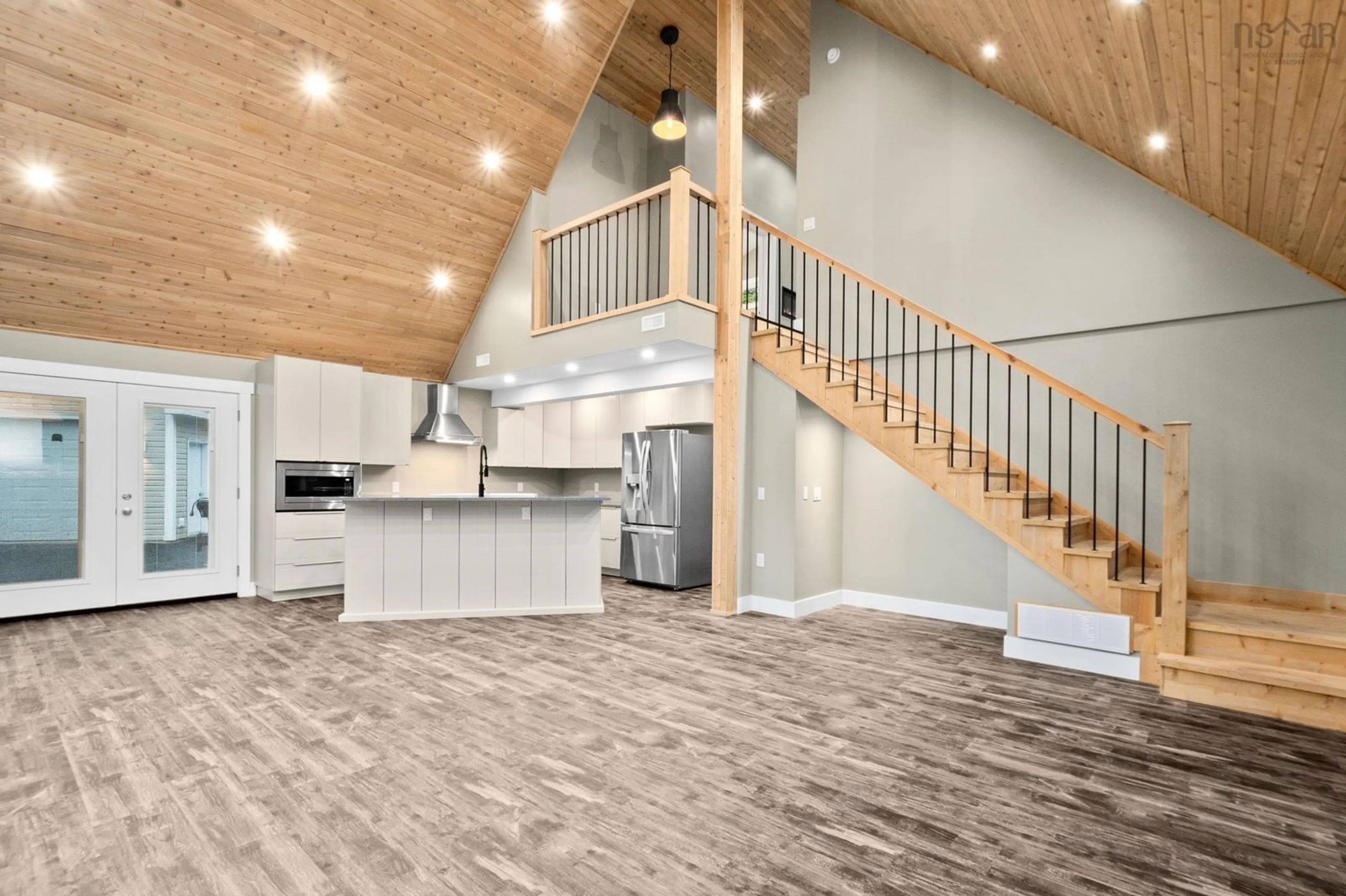 Open concept kitchen, wood/laminate floor for 660 St Andrews River Rd, Shubenacadie East Nova Scotia B0N 2H0