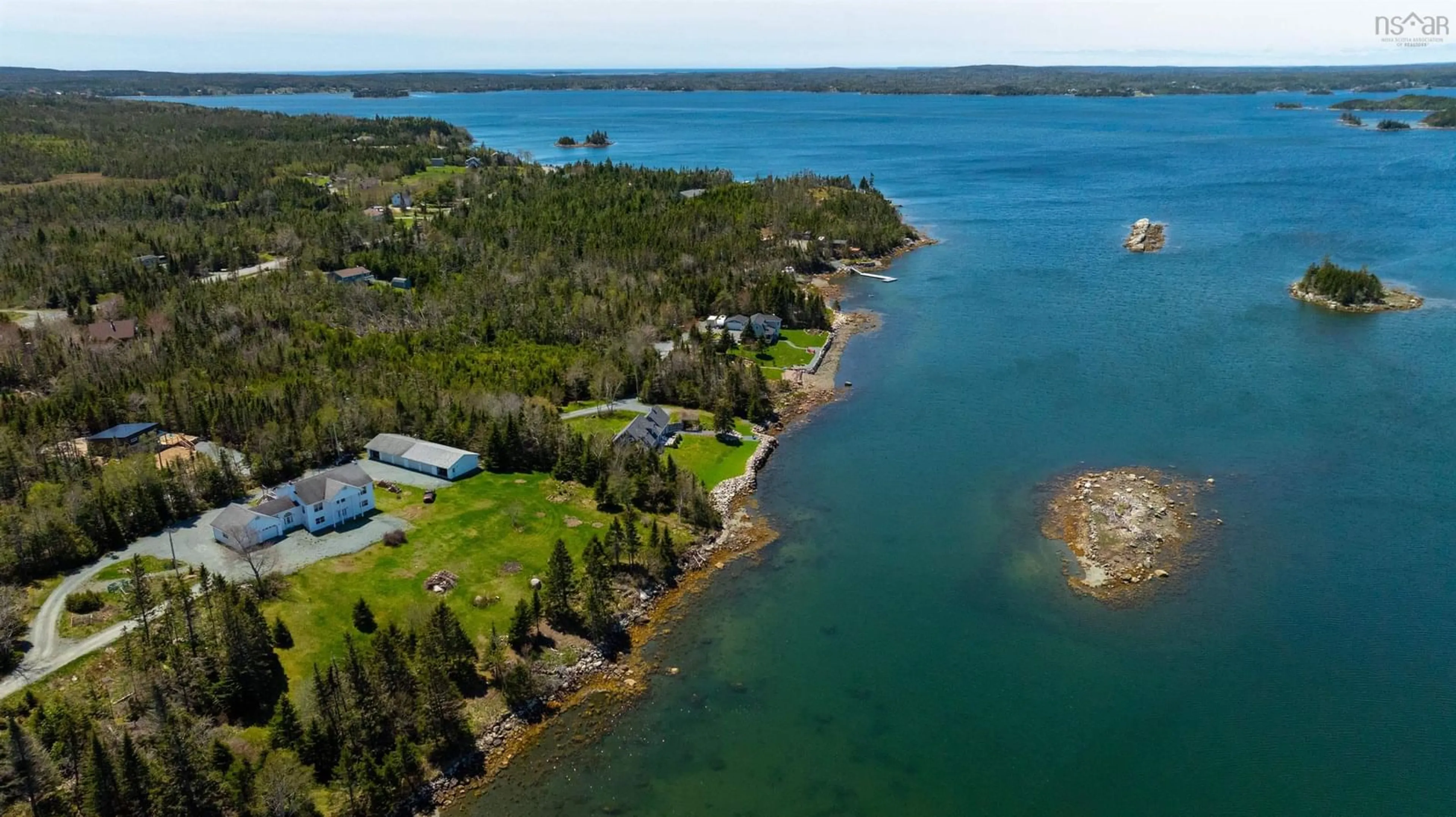 A pic from outside/outdoor area/front of a property/back of a property/a pic from drone, water/lake/river/ocean view for 46 Hills Dr, Oyster Pond Nova Scotia B0J 2L0