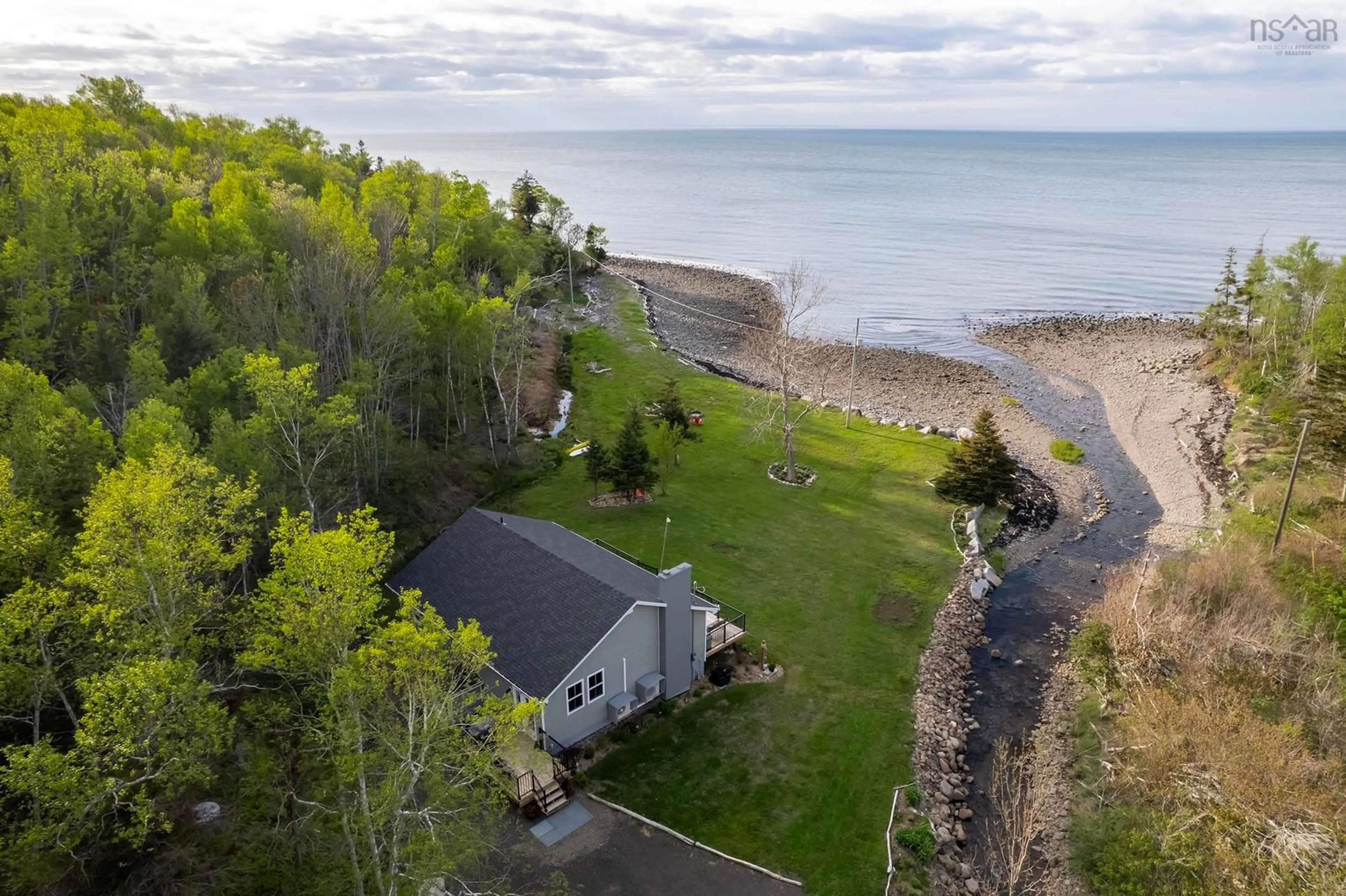 A pic from outside/outdoor area/front of a property/back of a property/a pic from drone, water/lake/river/ocean view for 7993 Shore Rd, Hampton Nova Scotia B0S 1L0