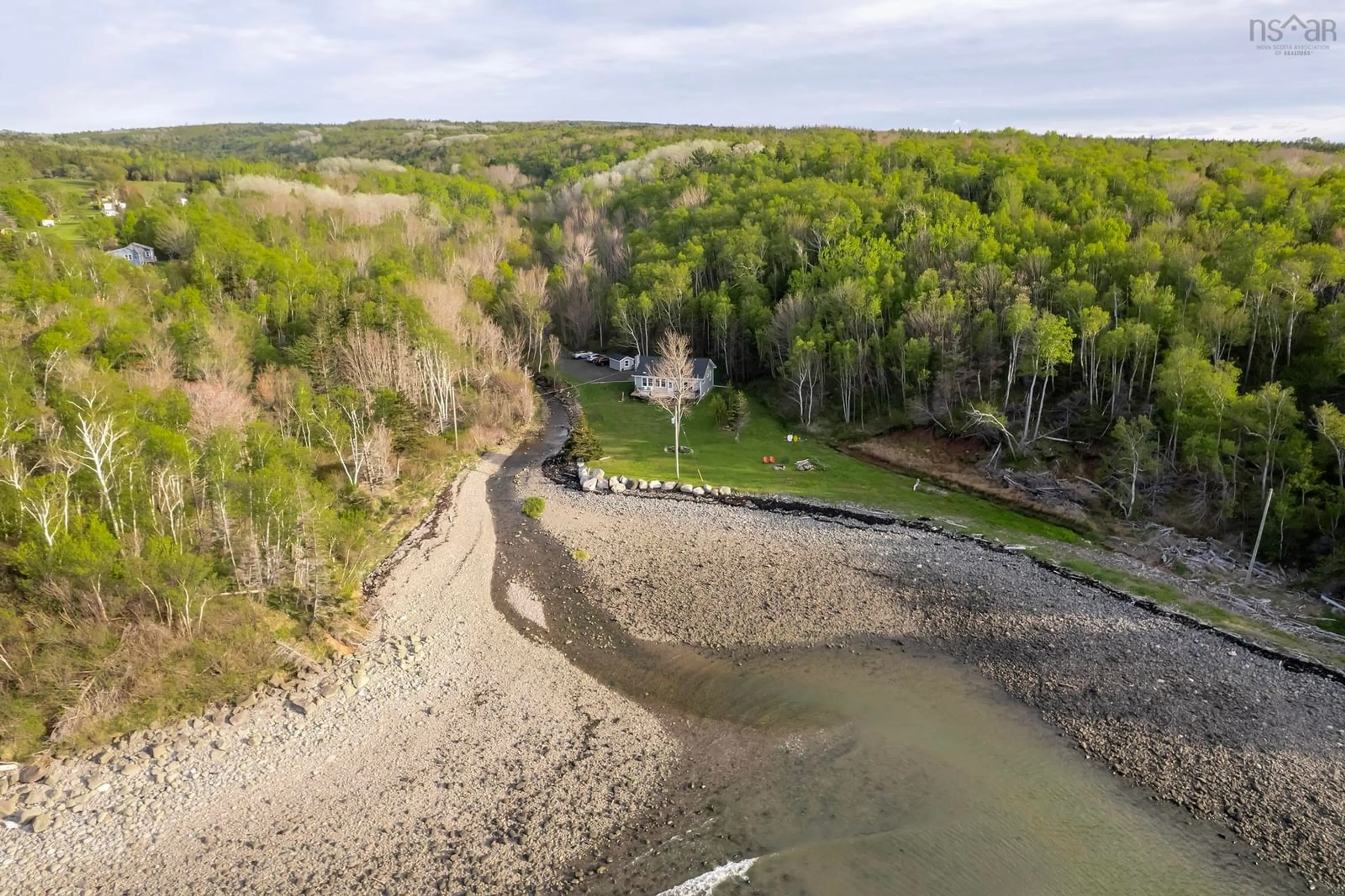 A pic from outside/outdoor area/front of a property/back of a property/a pic from drone, water/lake/river/ocean view for 7993 Shore Rd, Hampton Nova Scotia B0S 1L0