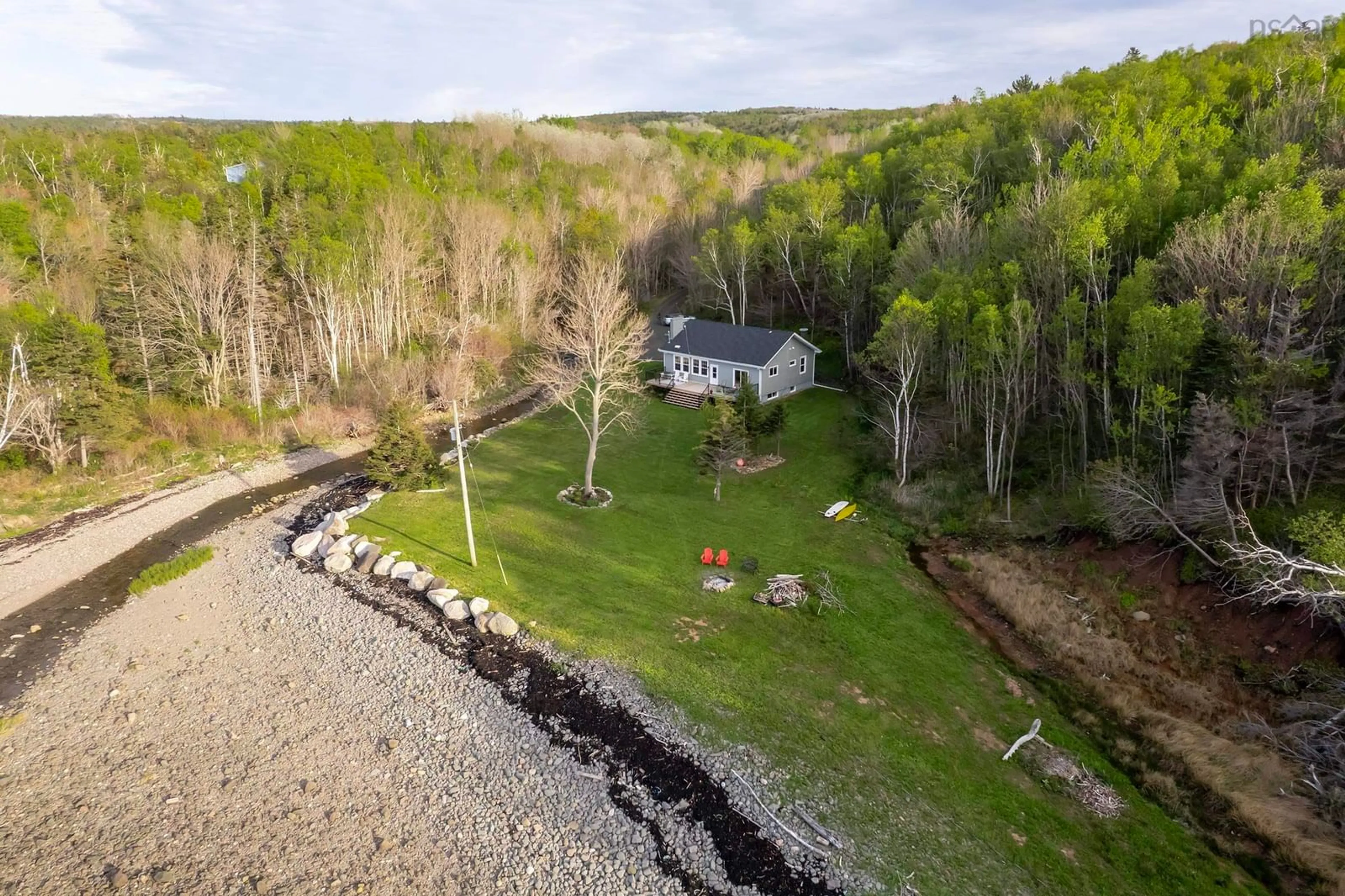 A pic from outside/outdoor area/front of a property/back of a property/a pic from drone, water/lake/river/ocean view for 7993 Shore Rd, Hampton Nova Scotia B0S 1L0