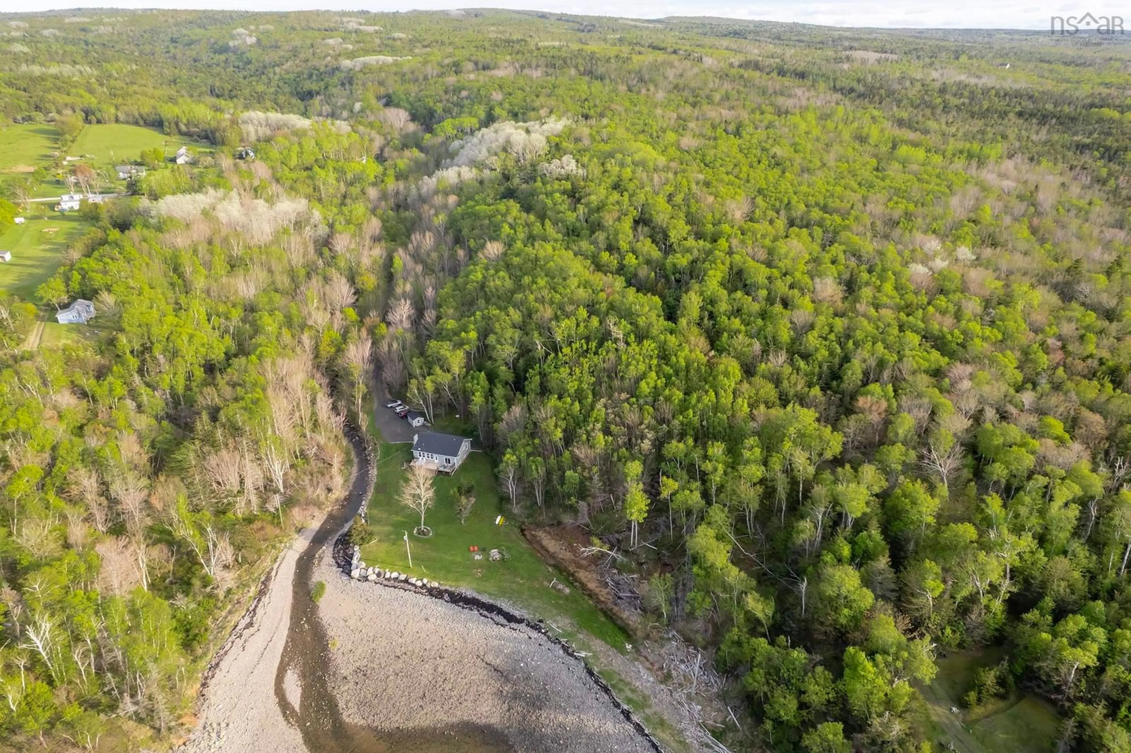 A pic from outside/outdoor area/front of a property/back of a property/a pic from drone, water/lake/river/ocean view for 7993 Shore Rd, Hampton Nova Scotia B0S 1L0