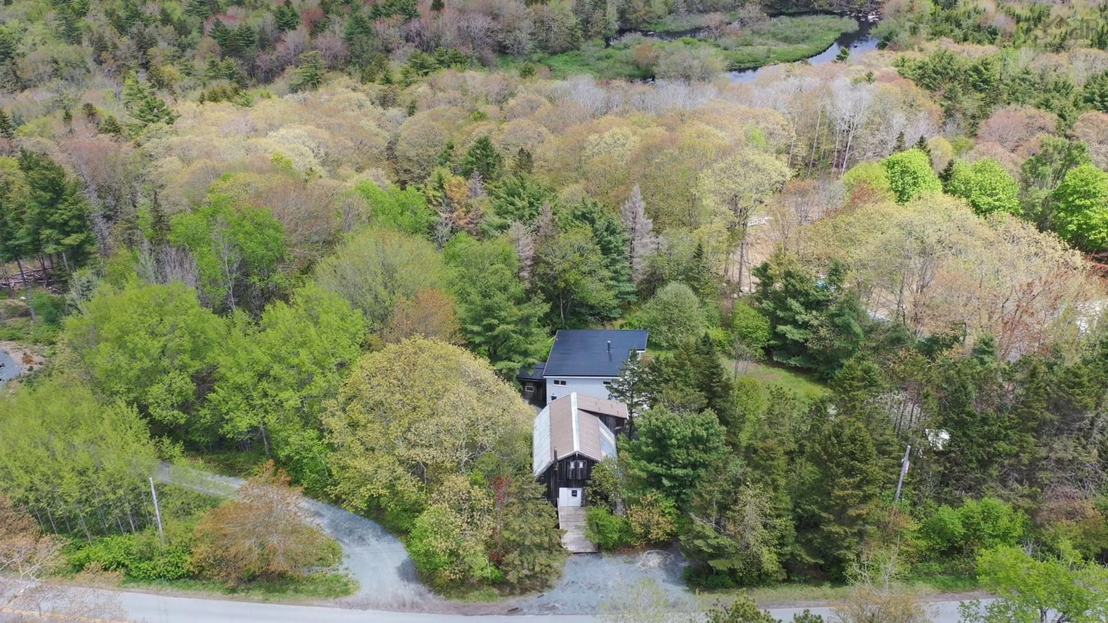 A pic from outside/outdoor area/front of a property/back of a property/a pic from drone, forest/trees view for 1195 Italy Cross Rd, Crousetown Nova Scotia B4V 6R5