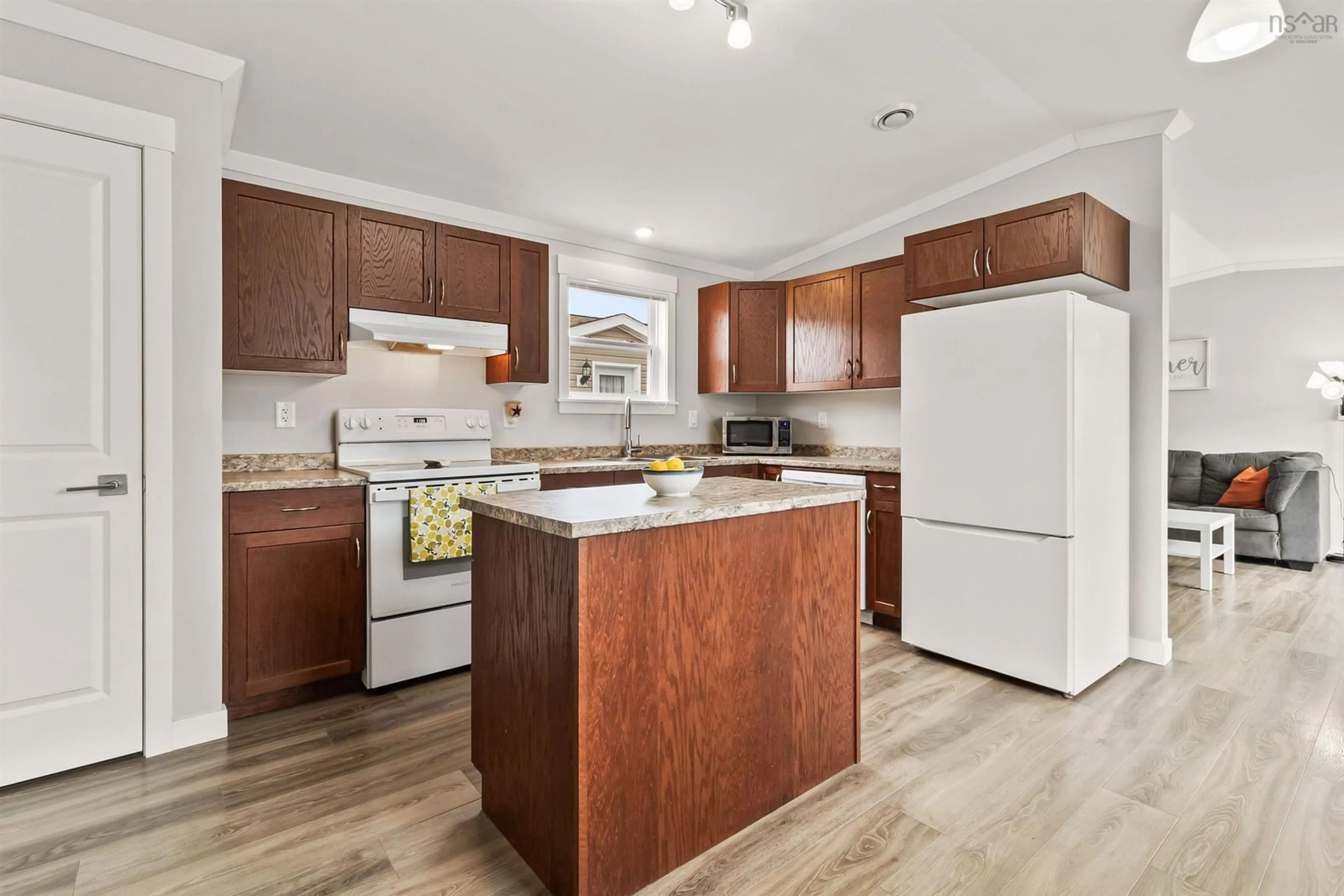 Open concept kitchen, wood/laminate floor for 26 Breeze Cir, Simms Settlement Nova Scotia B0J 1T0