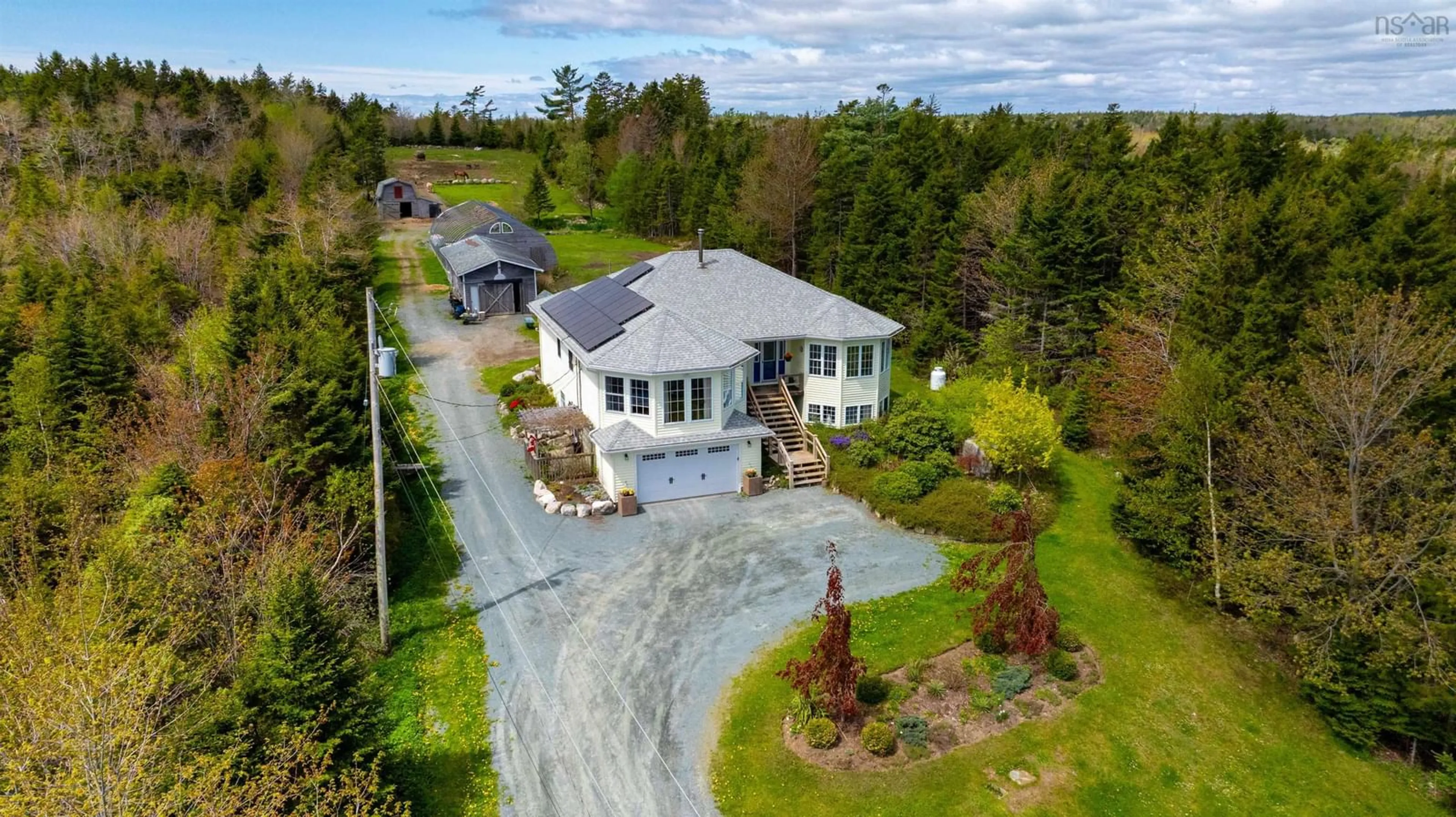 A pic from outside/outdoor area/front of a property/back of a property/a pic from drone, street for 640 Myra Rd, Porters Lake Nova Scotia B3E 1G4