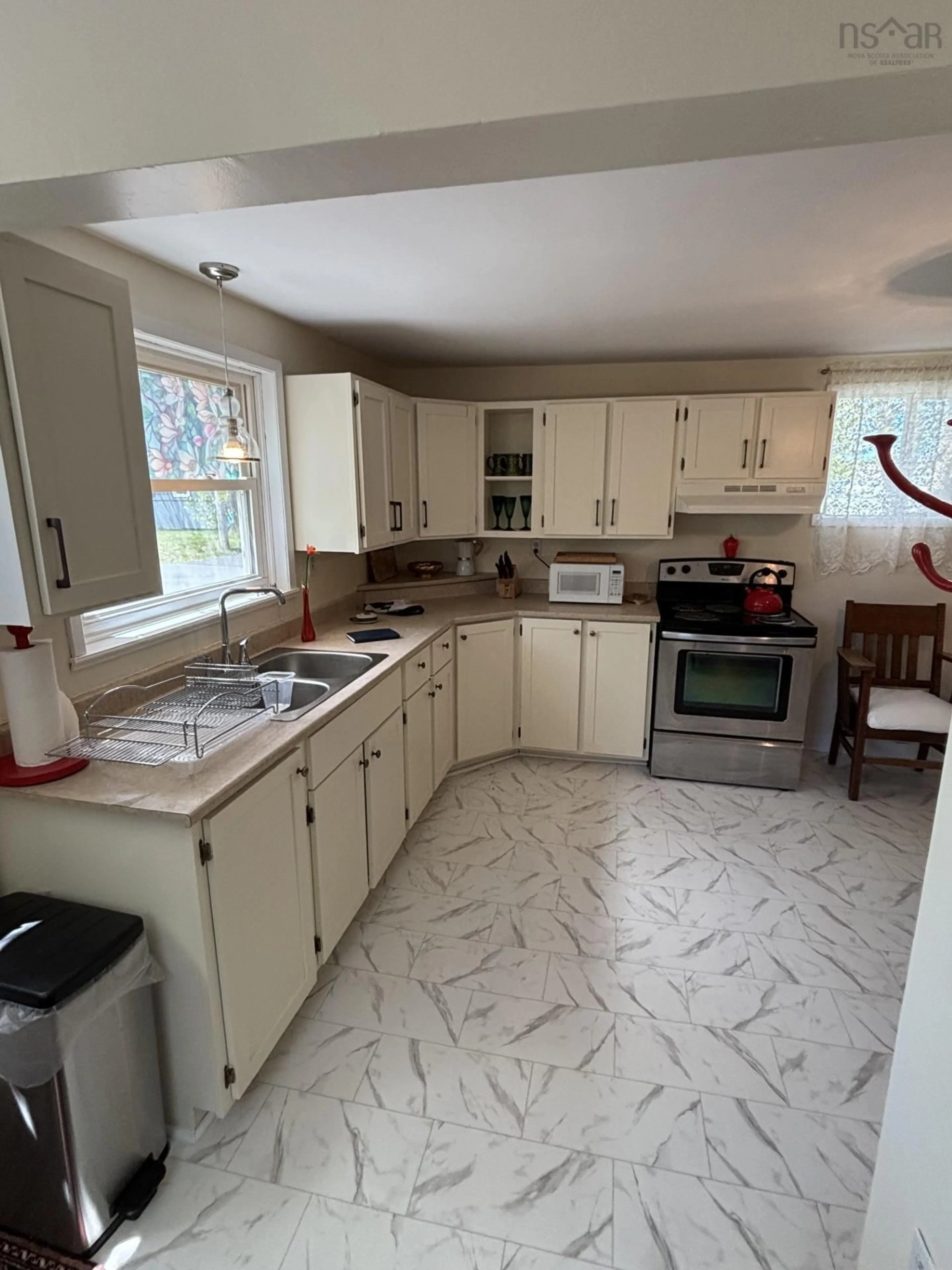 Open concept kitchen, ceramic/tile floor for 12 Beech St, North Sydney Nova Scotia B2A 1H3