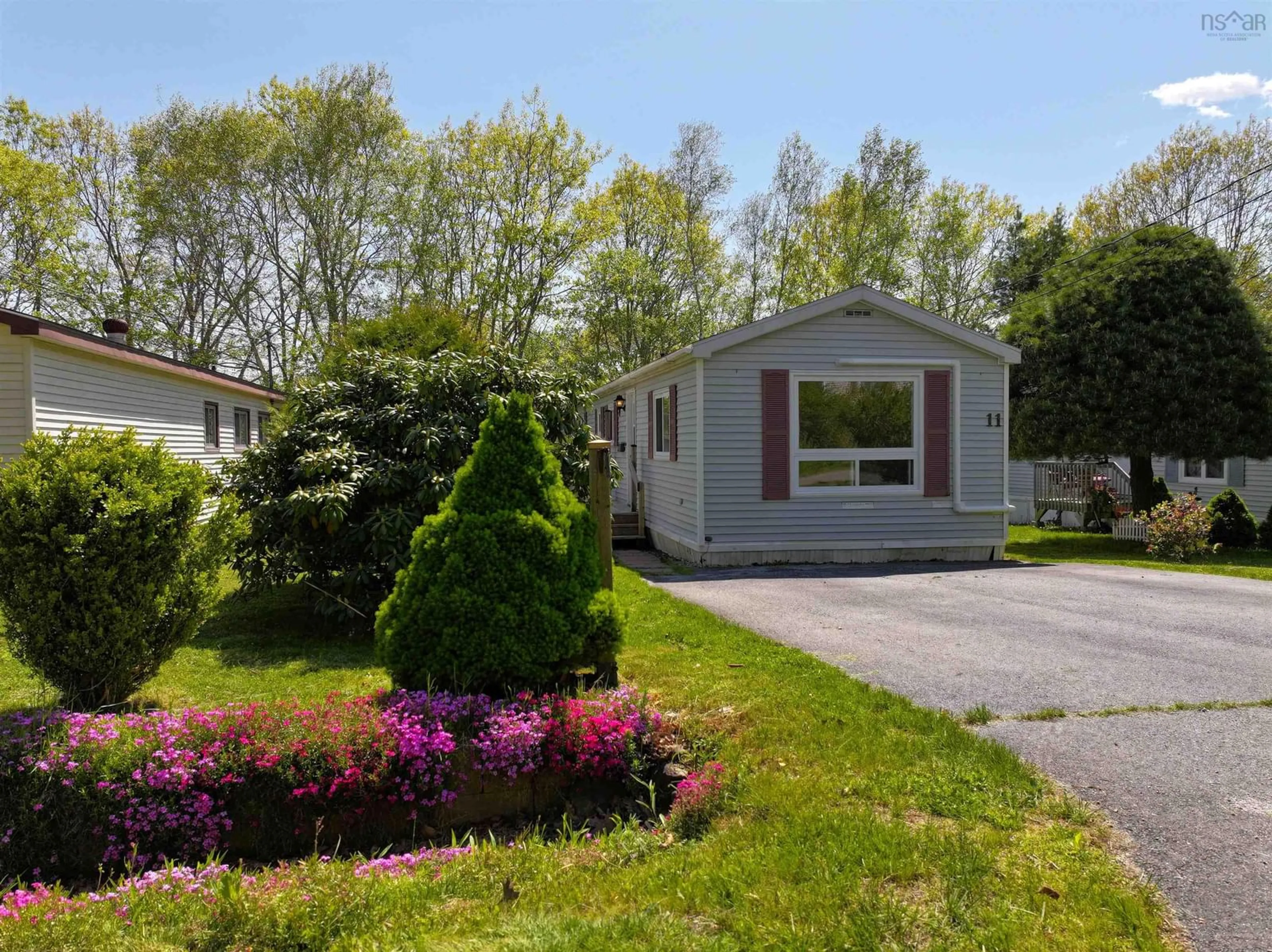 Home with vinyl exterior material, street for 11 Autumn St, Bridgewater Nova Scotia B4V 3S8