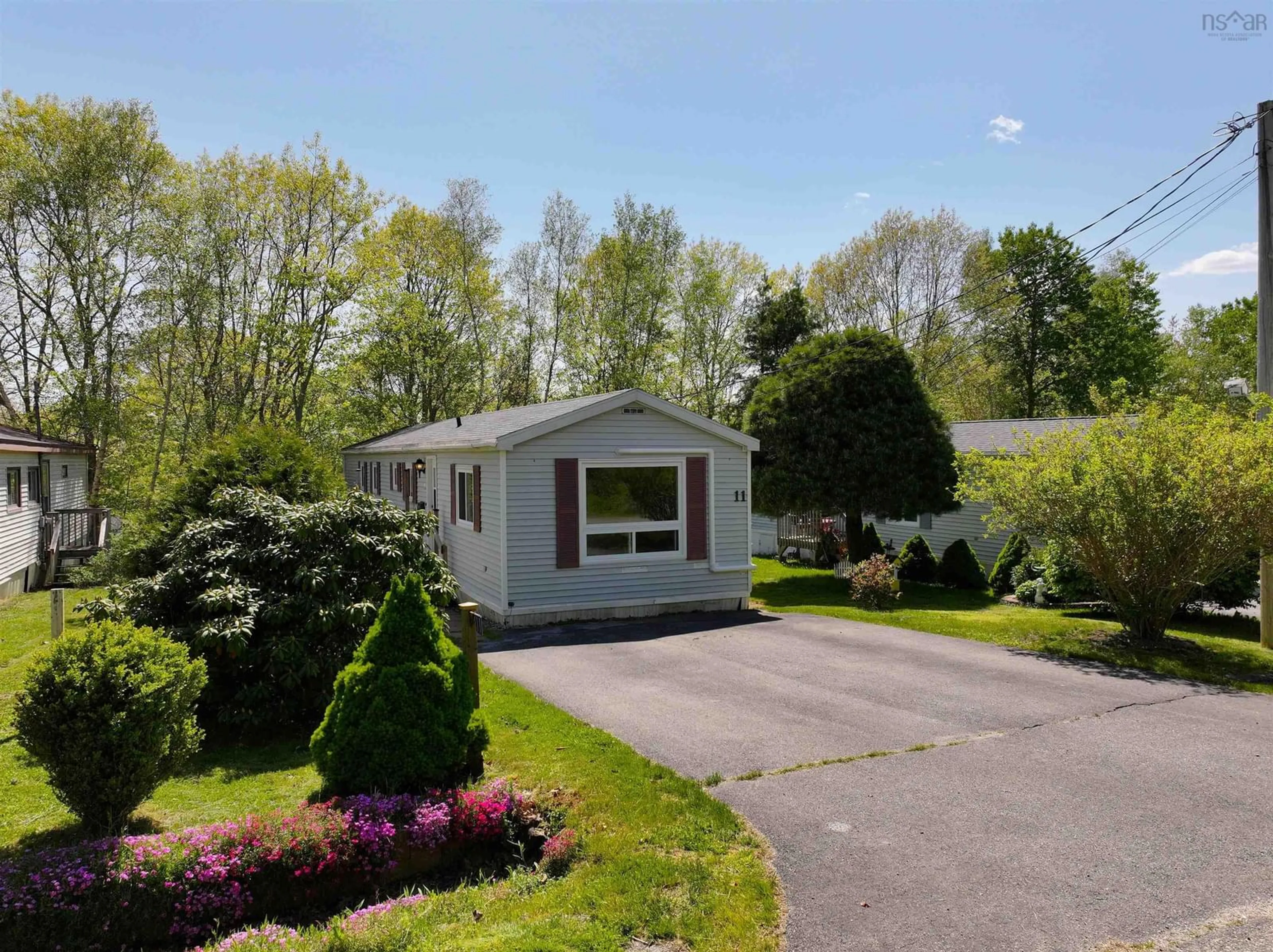 Home with vinyl exterior material, street for 11 Autumn St, Bridgewater Nova Scotia B4V 3S8