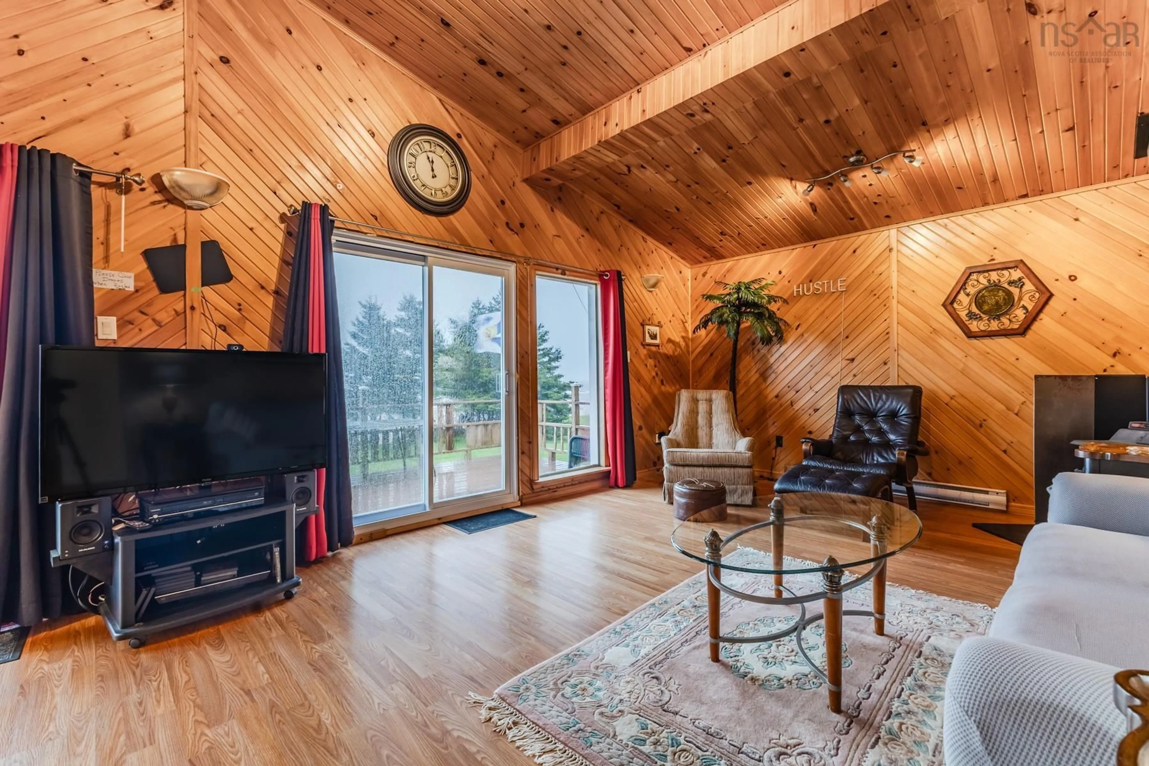 Living room with furniture, wood/laminate floor for 106 Island View Subdivision Rd, Malagash Nova Scotia B0K 1E0