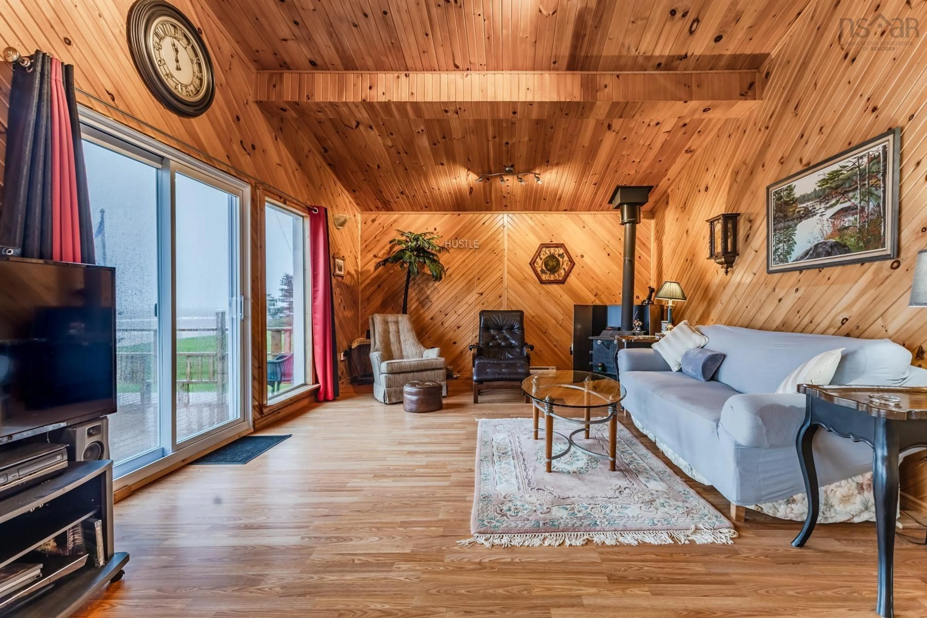 Living room with furniture, wood/laminate floor for 106 Island View Subdivision Rd, Malagash Nova Scotia B0K 1E0