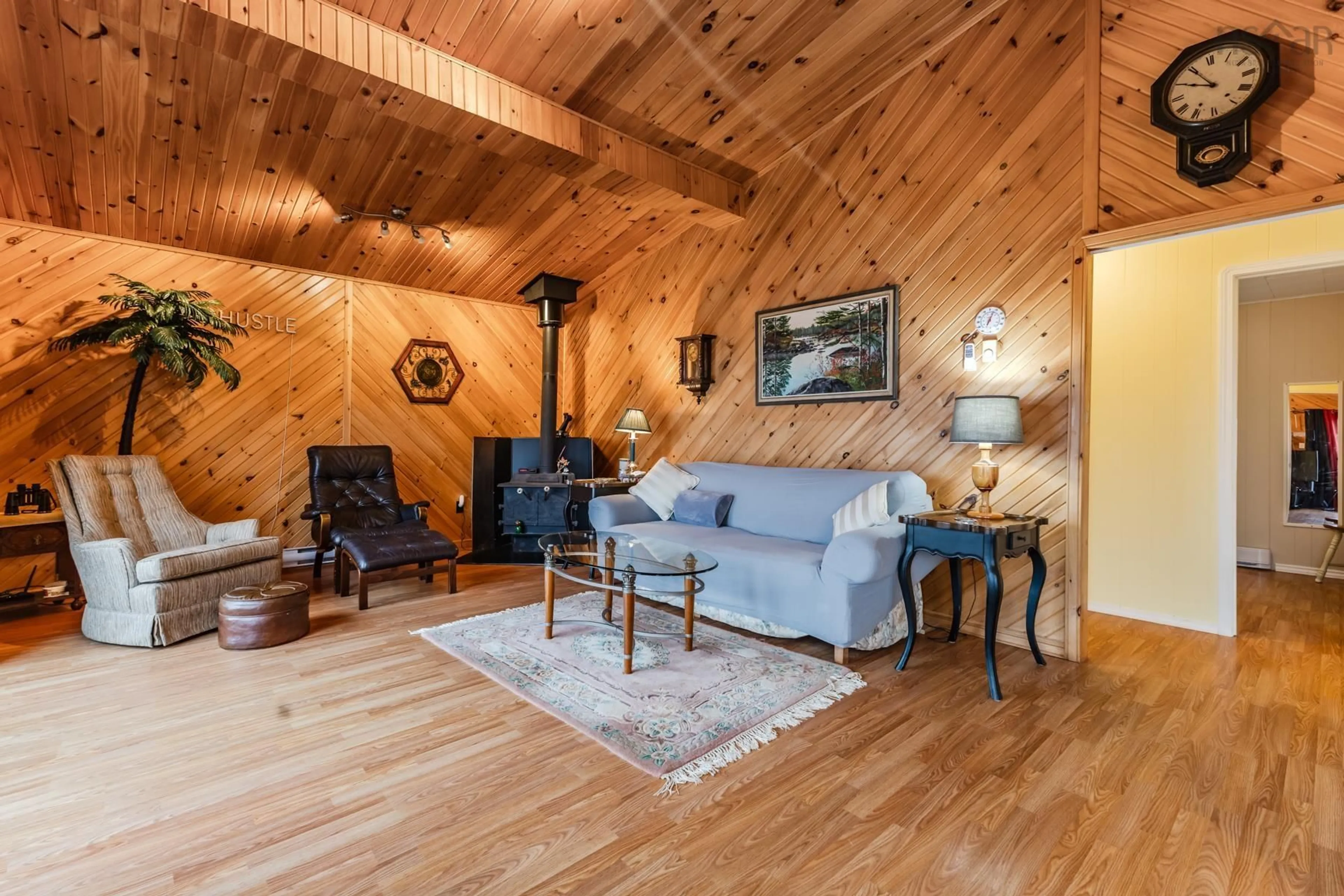 Living room with furniture, wood/laminate floor for 106 Island View Subdivision Rd, Malagash Nova Scotia B0K 1E0
