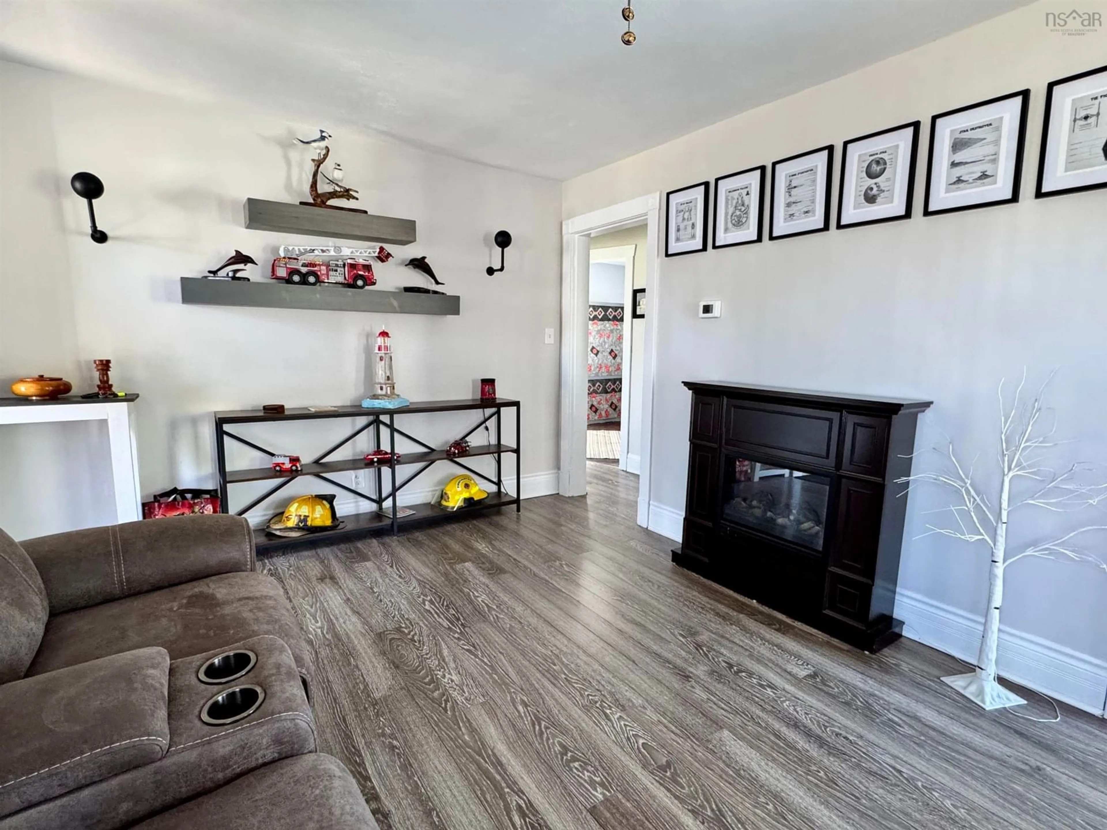 Living room with furniture, wood/laminate floor for 38 Harbourview Dr, Sydney Nova Scotia B1S 2A6