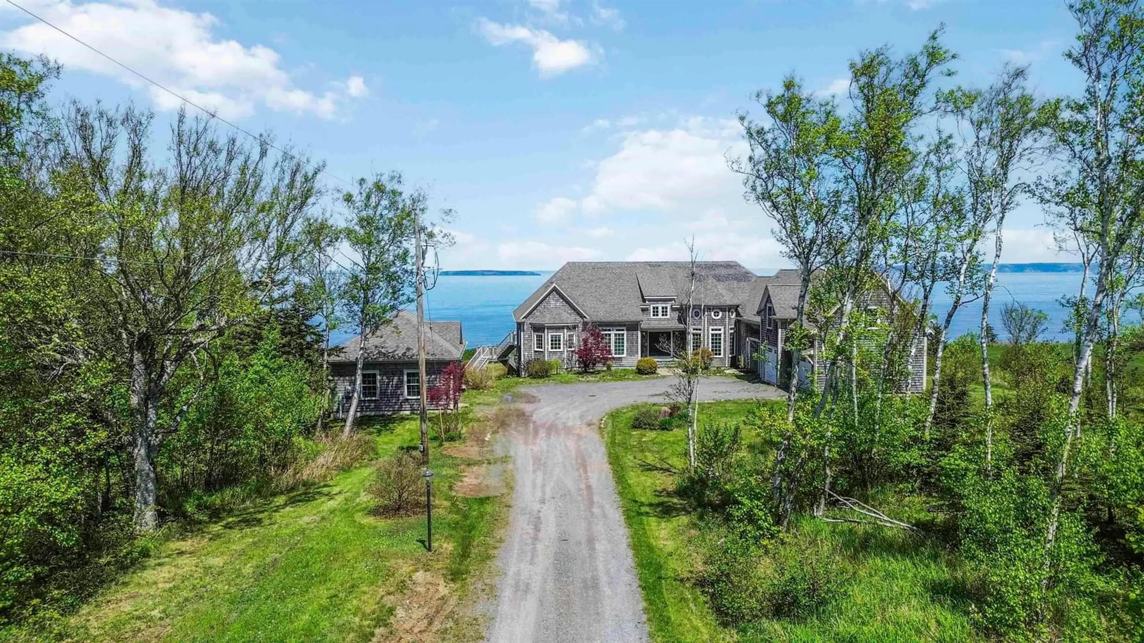 A pic from outside/outdoor area/front of a property/back of a property/a pic from drone, water/lake/river/ocean view for 70 Fundy Bay Dr, Victoria Harbour Nova Scotia B0P 1C0