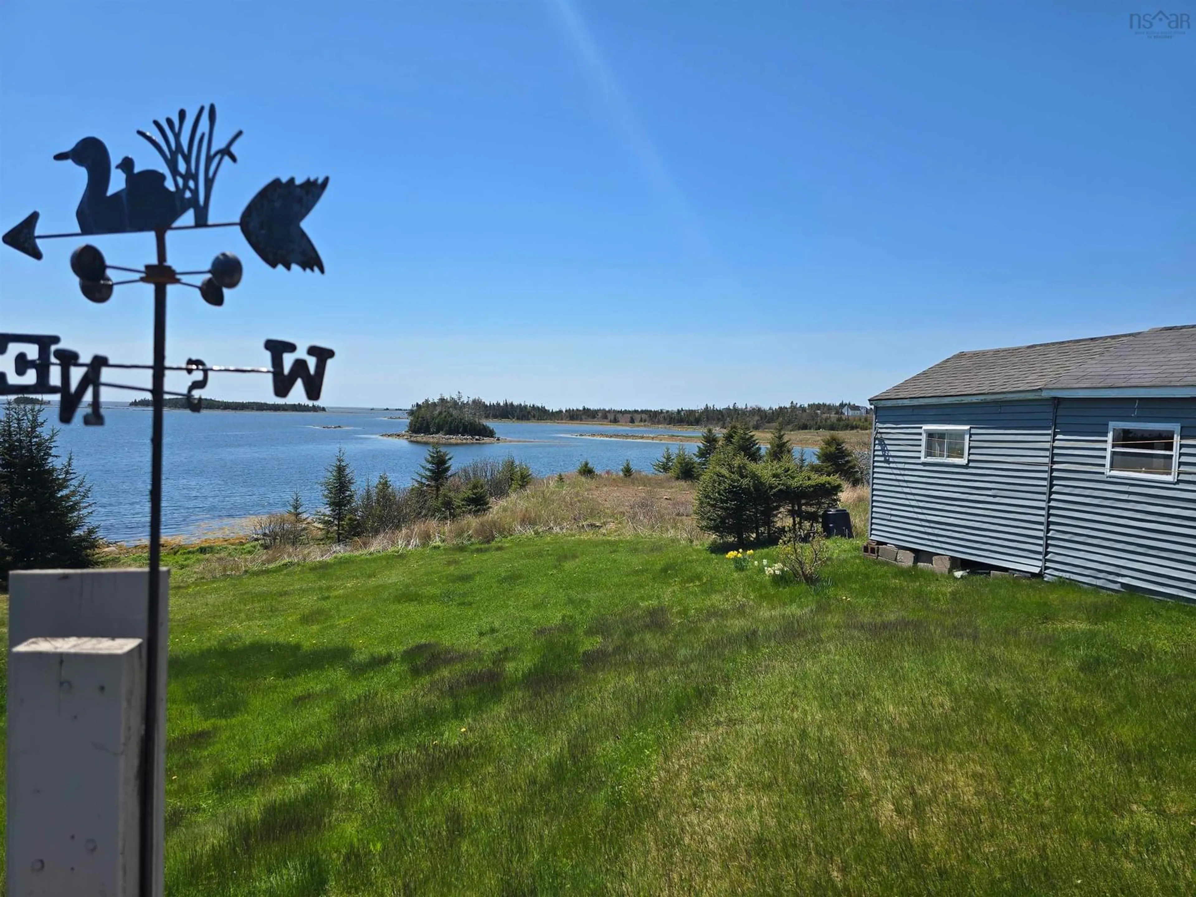 A pic from outside/outdoor area/front of a property/back of a property/a pic from drone, water/lake/river/ocean view for 5182 Hwy 211, Port Bickerton Nova Scotia B0J 1A0