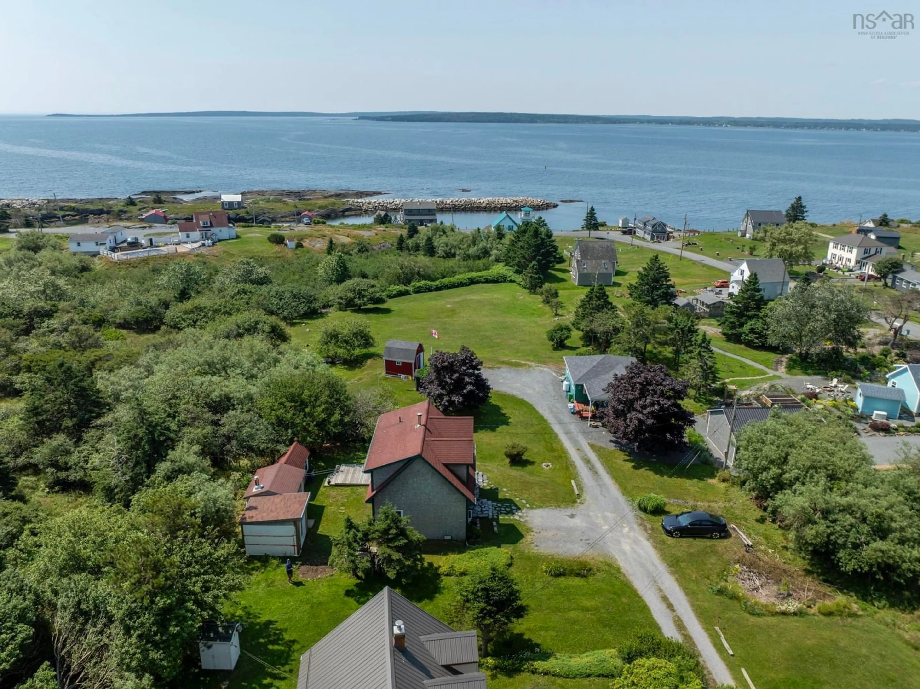 A pic from outside/outdoor area/front of a property/back of a property/a pic from drone, water/lake/river/ocean view for 23 Ocean View Dr, Blue Rocks Nova Scotia B0J 2C0