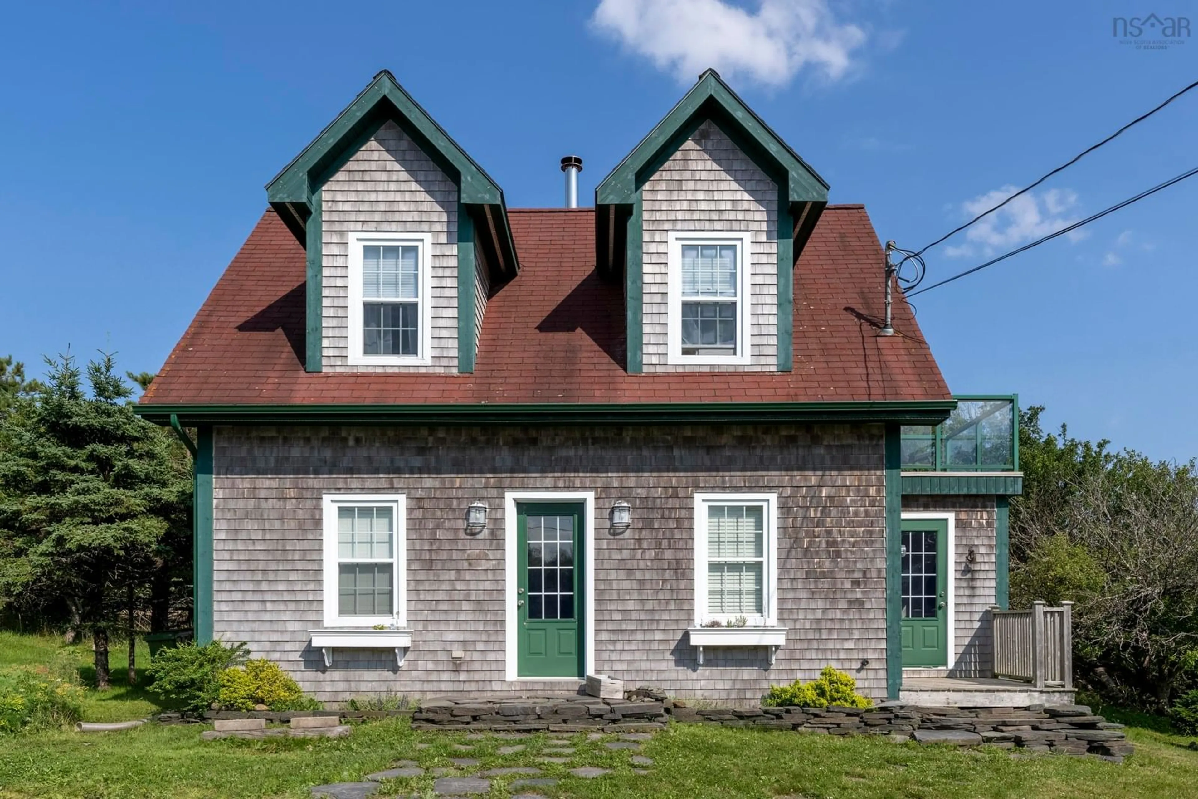 Home with brick exterior material, street for 23 Ocean View Dr, Blue Rocks Nova Scotia B0J 2C0