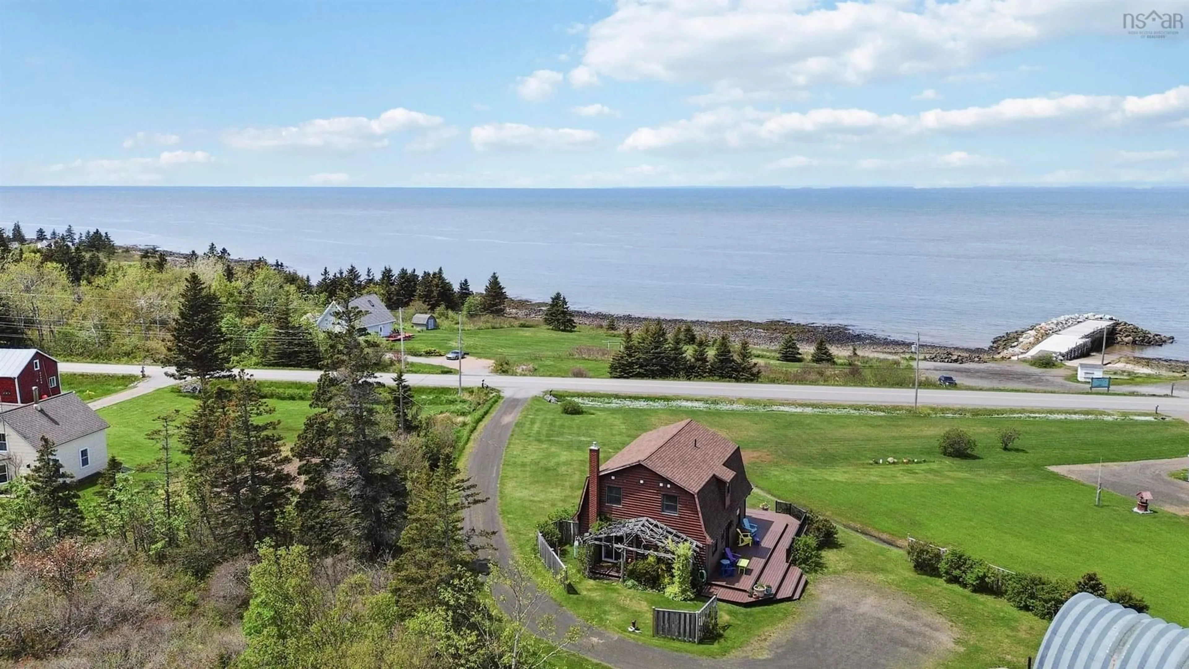 A pic from outside/outdoor area/front of a property/back of a property/a pic from drone, water/lake/river/ocean view for 11866 Shore Rd, Cottage Cove Nova Scotia B0S 1P0