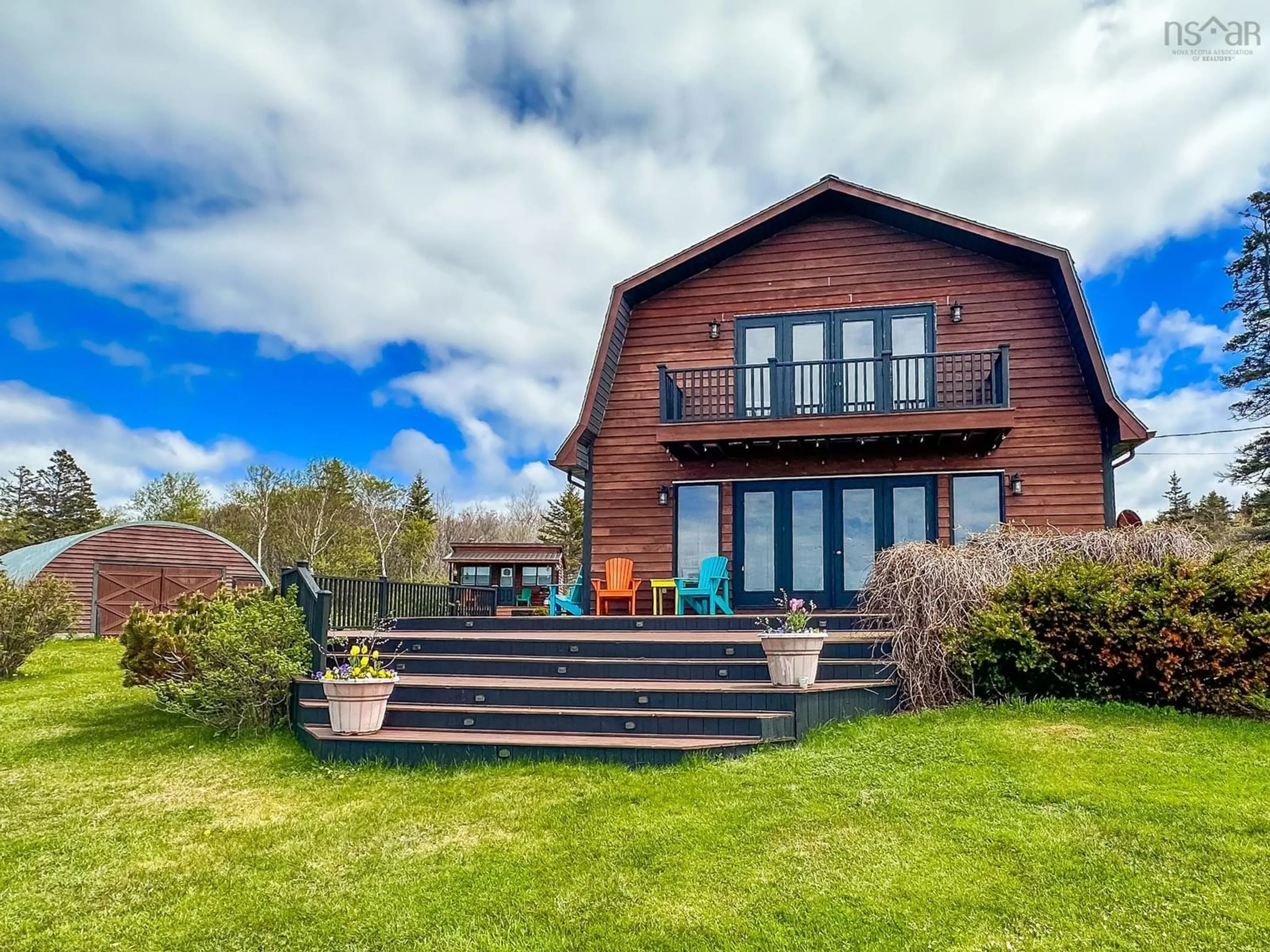 A pic from outside/outdoor area/front of a property/back of a property/a pic from drone, water/lake/river/ocean view for 11866 Shore Rd, Cottage Cove Nova Scotia B0S 1P0