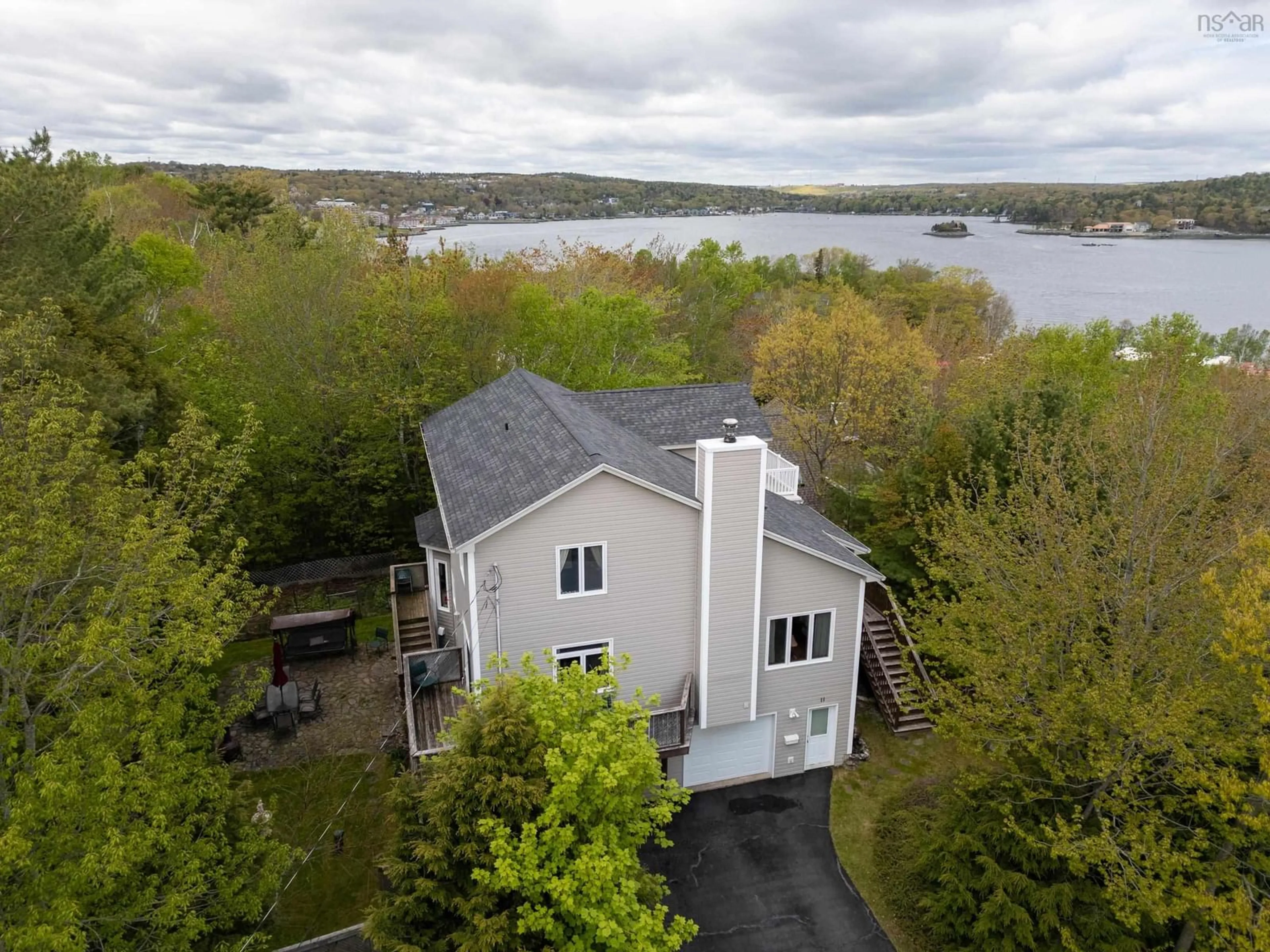 A pic from outside/outdoor area/front of a property/back of a property/a pic from drone, water/lake/river/ocean view for 11 Millview Ave, Bedford Nova Scotia B4A 1G8