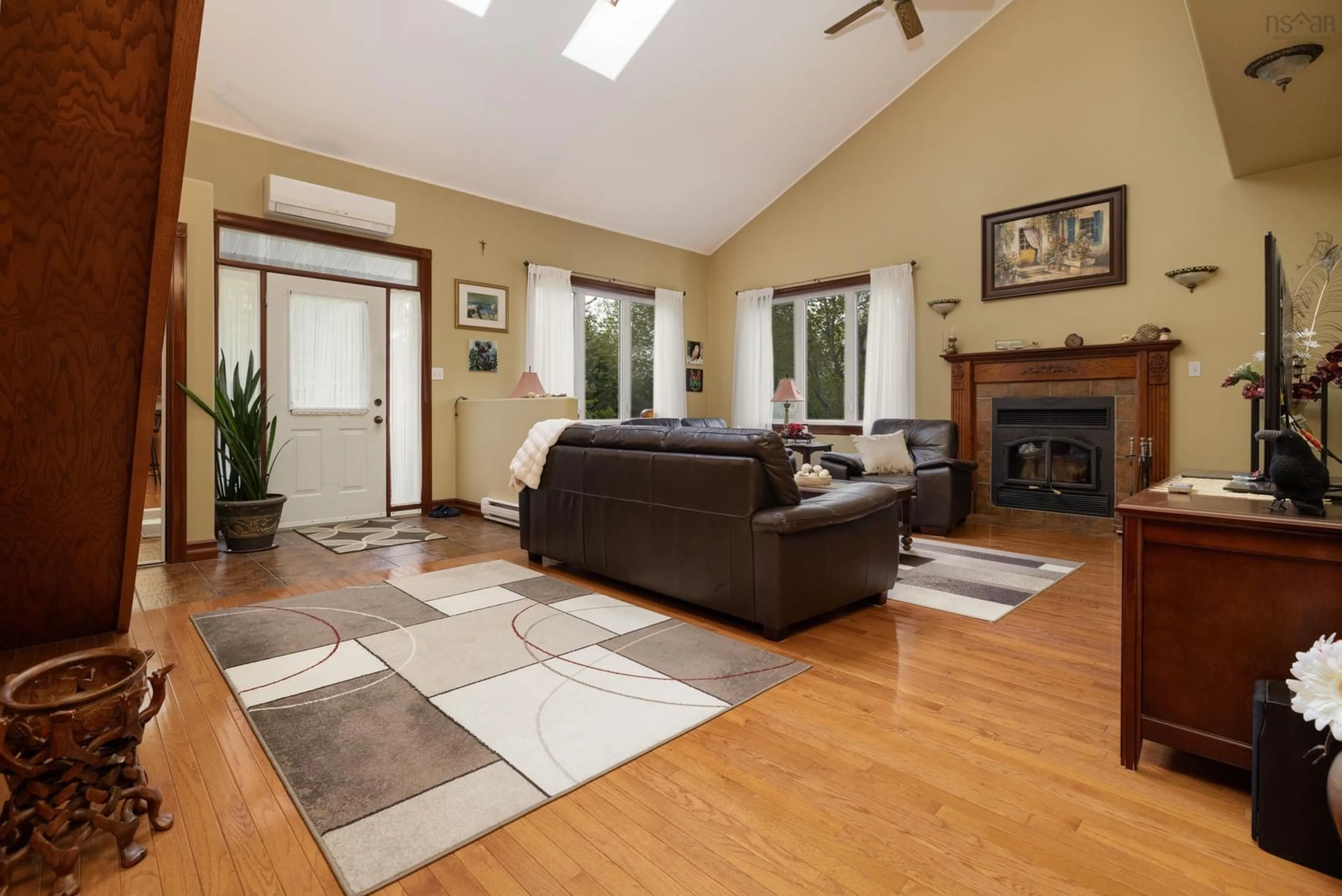 Living room with furniture, wood/laminate floor for 11 Millview Ave, Bedford Nova Scotia B4A 1G8